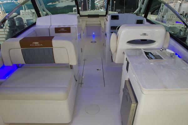 Manufacturer Provided Image: Interior of a 2020 Cobia 280 Dual Console boat with seating and amenities.