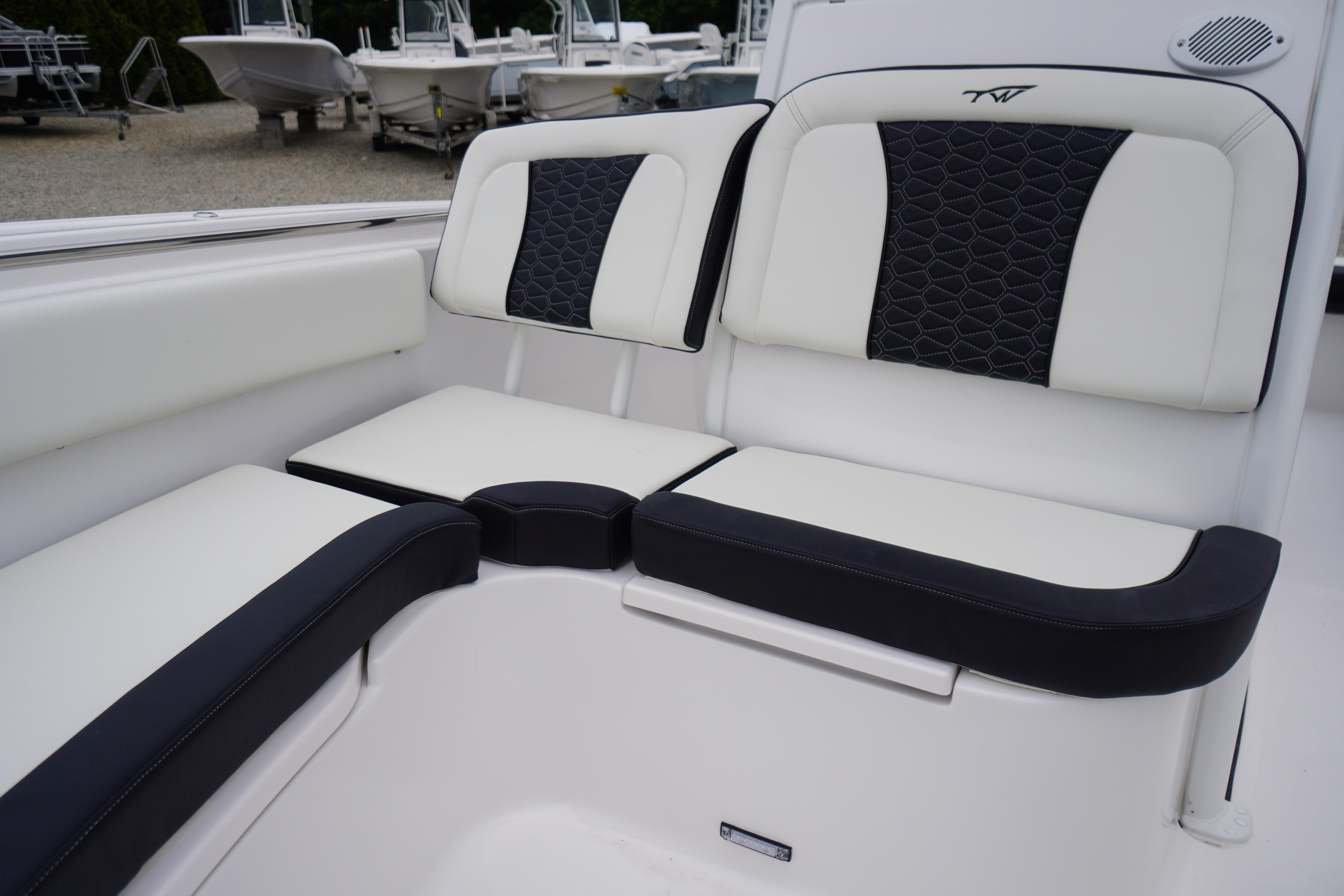 2026 Tidewater 232 SS boat interior with stylish white and black seating.
