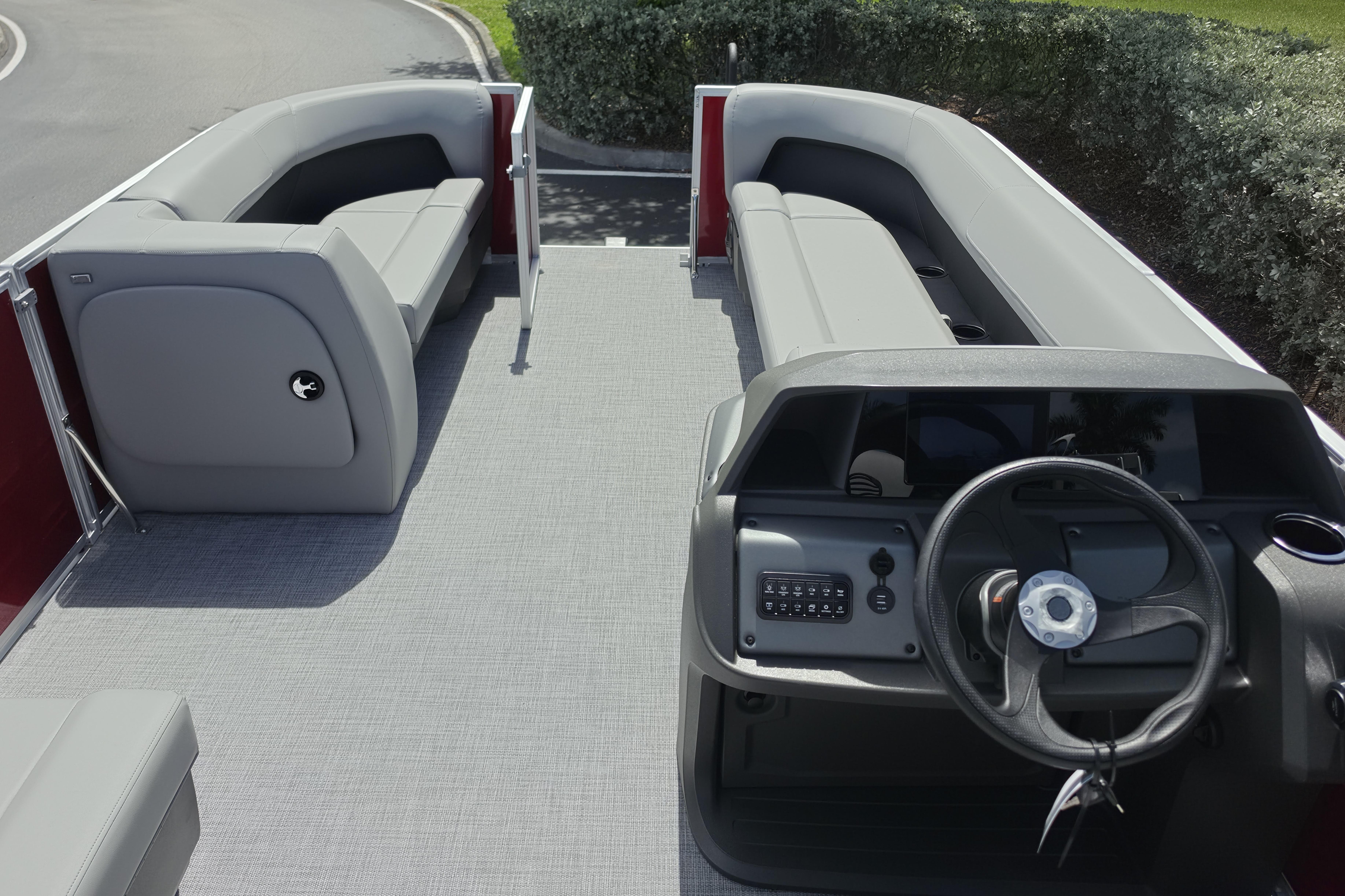 2026 Sun Tracker Party Barge 18 DLX interior with spacious seating and modern helm.