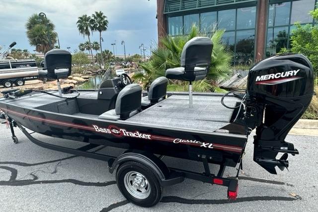 2026 Tracker Bass Tracker Classic XL boat with Mercury engine, parked outdoors.