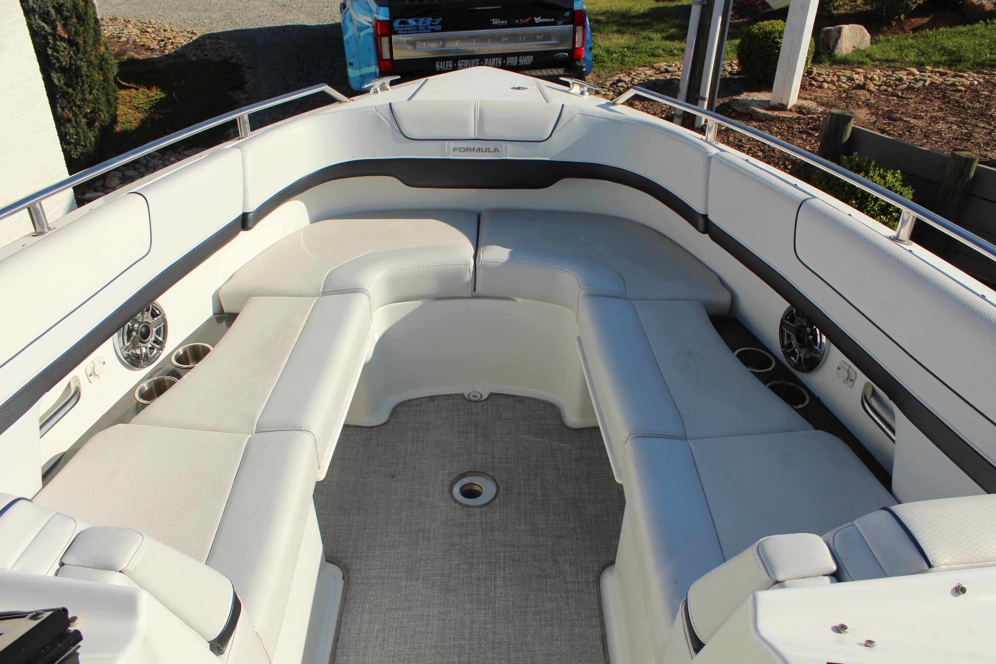 2023 Formula 310 Bowrider I/O boat interior with spacious seating and modern design.