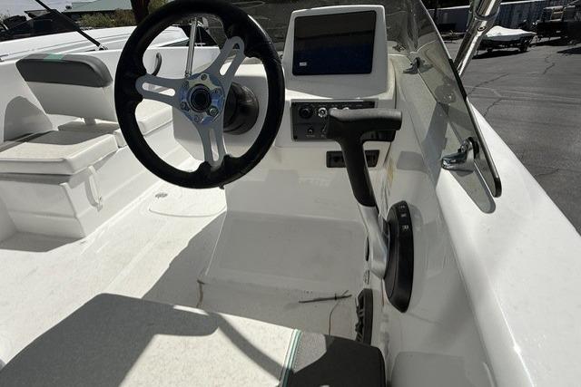 2026 Tahoe T18 boat cockpit with steering wheel and control panel.