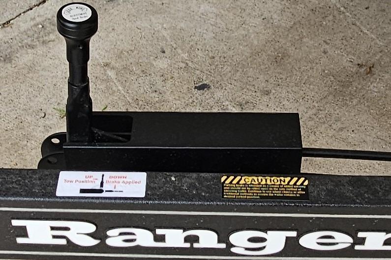 Trailer hitch mechanism on 2026 Ranger Z521R Cup-Equipped, featuring tow and brake positions.