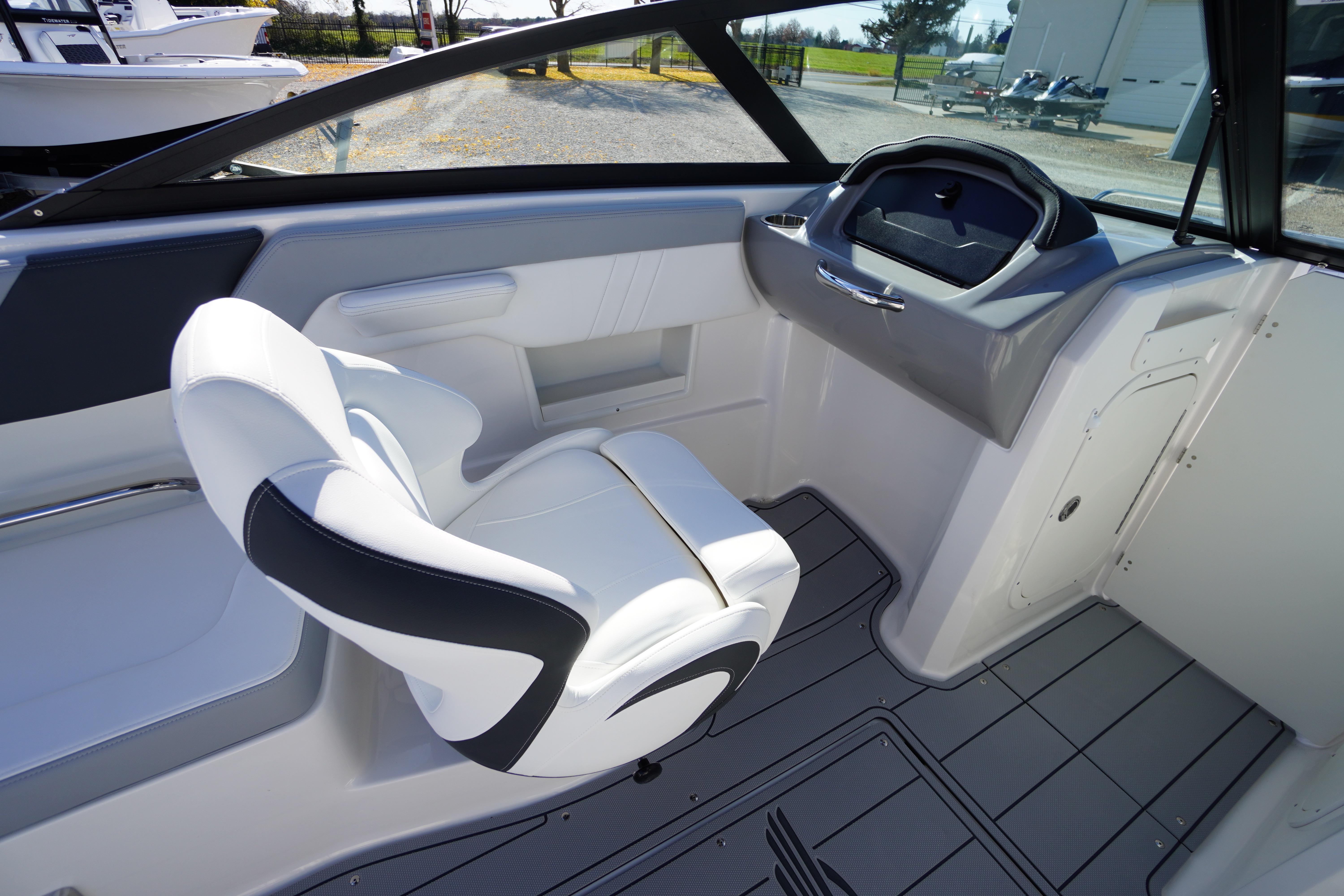 Interior of 2026 Chaparral 23 SSi OB boat with sleek seating and modern dashboard.