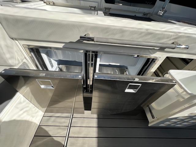 2024 Sea Ray SLX 400 OB yacht with open storage compartments