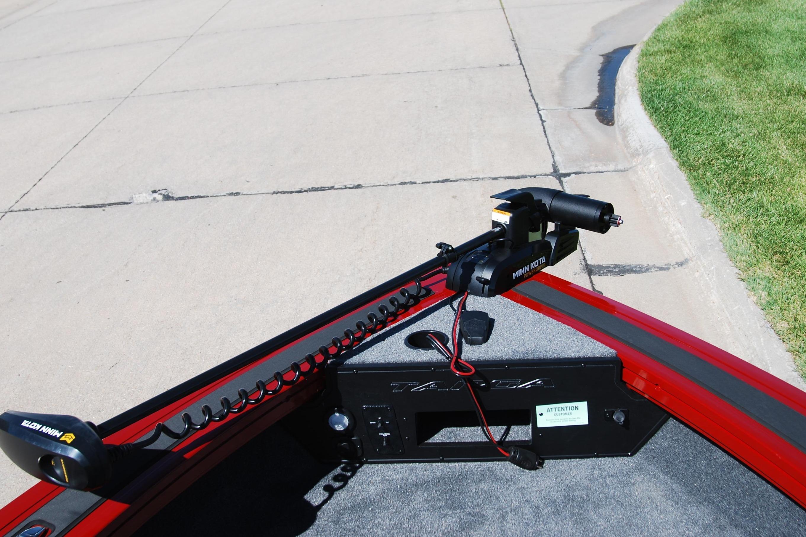 2026 Tracker Targa V-18 WT boat with Minn Kota trolling motor on pavement.