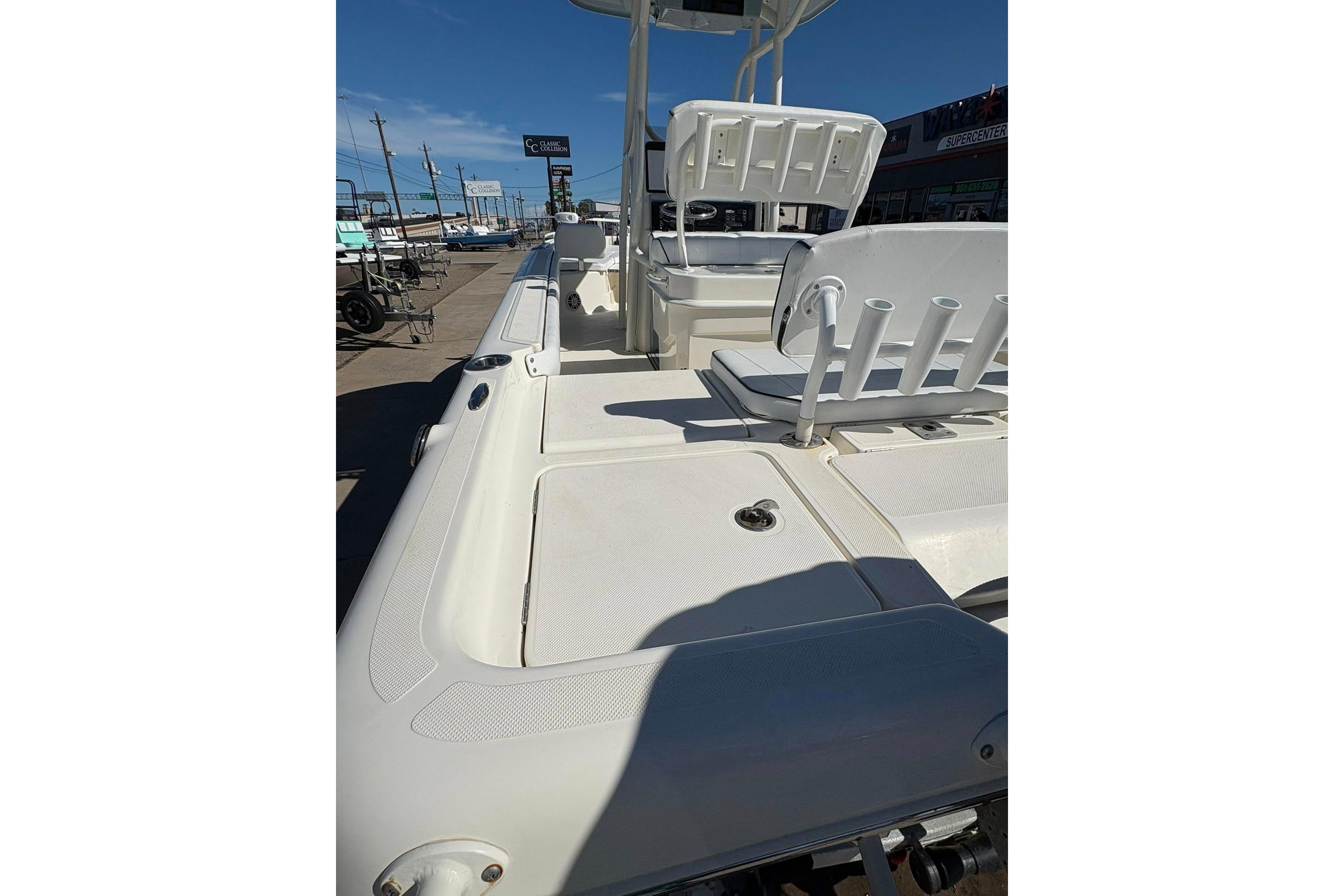 2023 Skeeter SX2550 Family boat deck with seating and storage compartments.