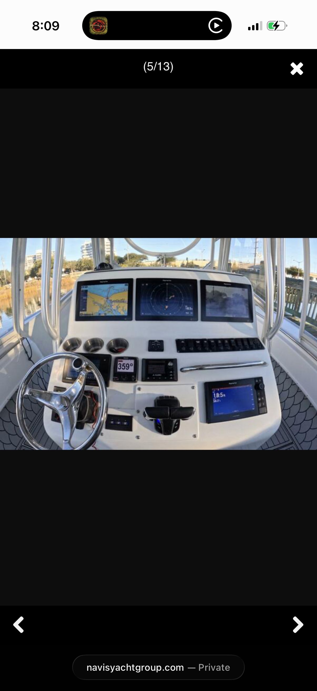 Helm of a Cape Horn 36T boat with multiple screens and controls.