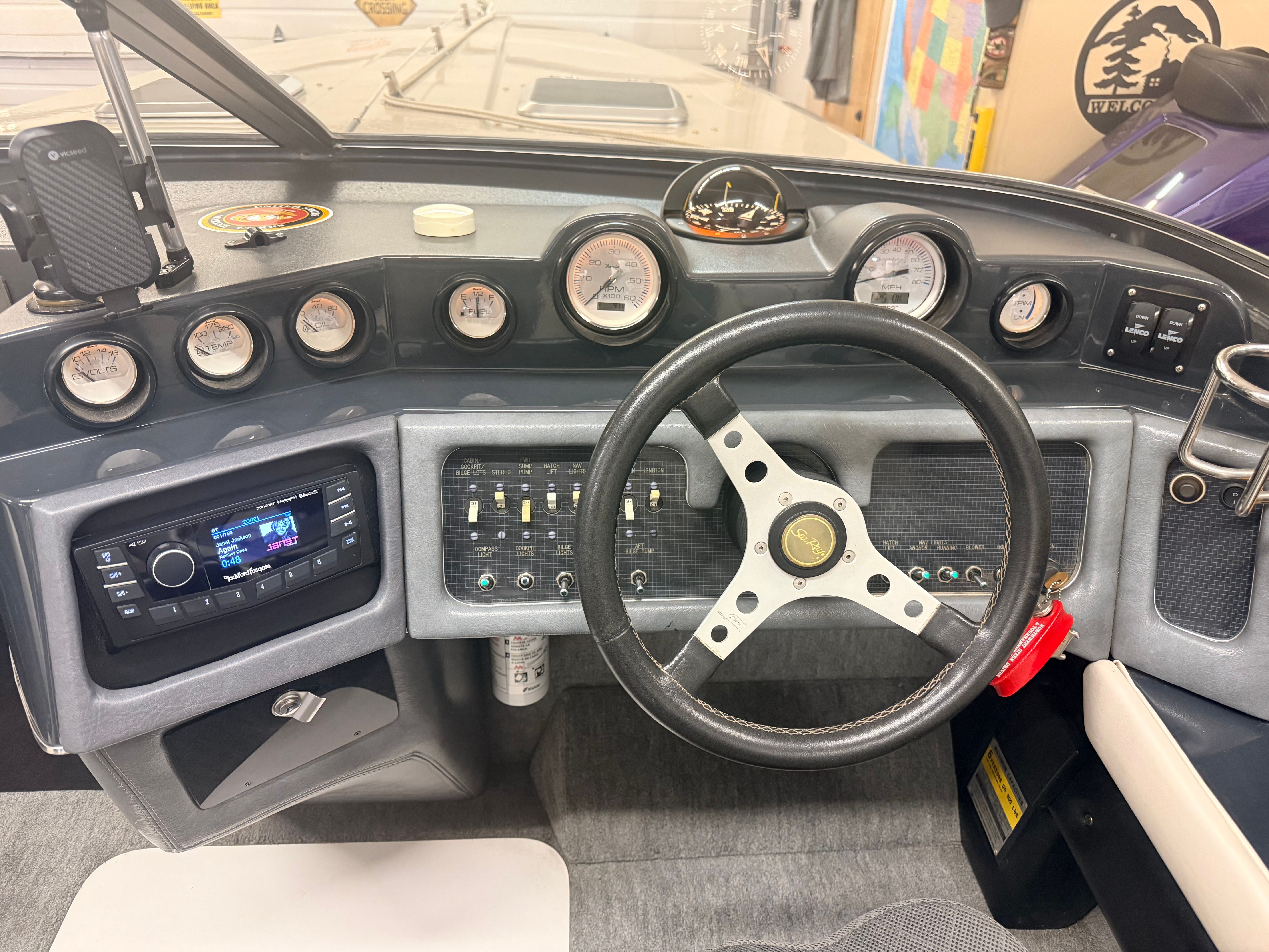 Dashboard of a 1986 Sea Ray Pachanga 11 with steering wheel and instruments.