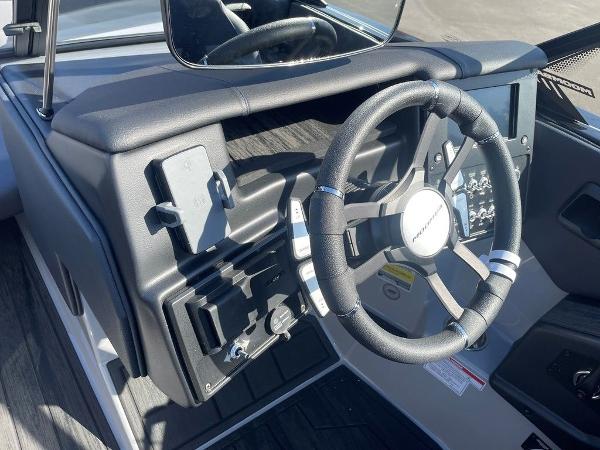 2025 Moomba Mondo boat dashboard with steering wheel and control panel.