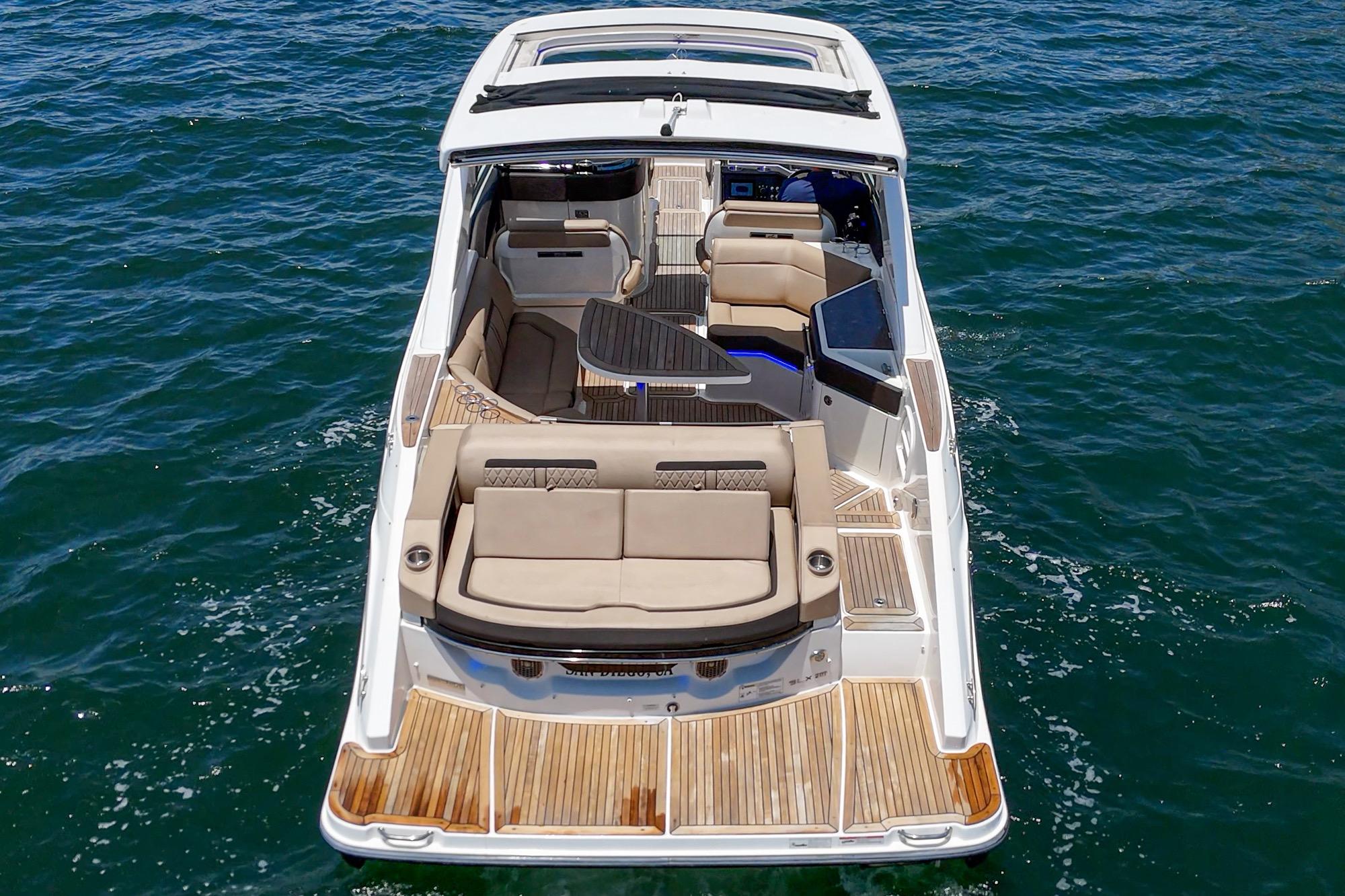 2018 Sea Ray SLX 310 boat with spacious seating on open water.