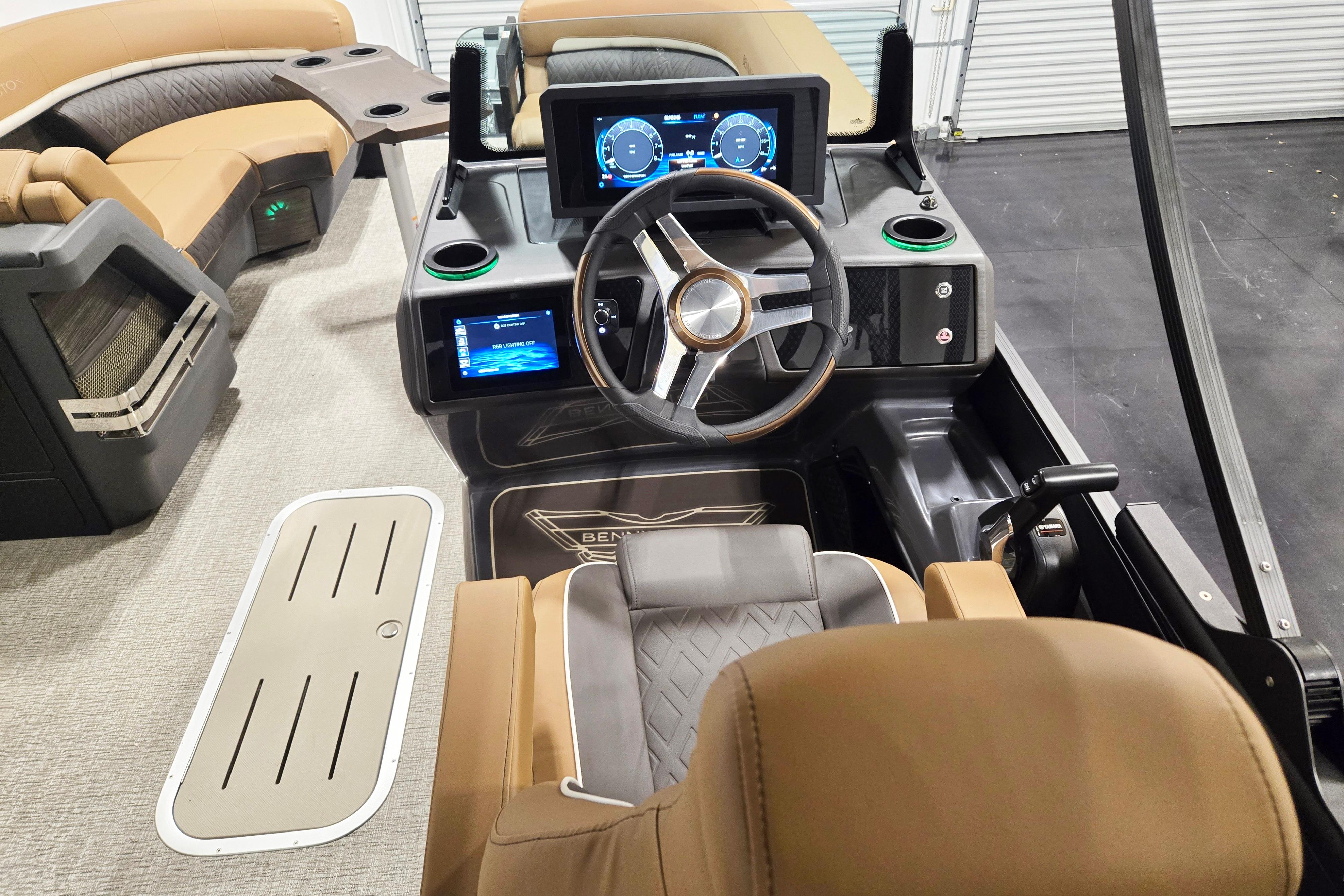 2026 Bennington 22 M Swingback boat interior with modern dashboard and luxurious seating.
