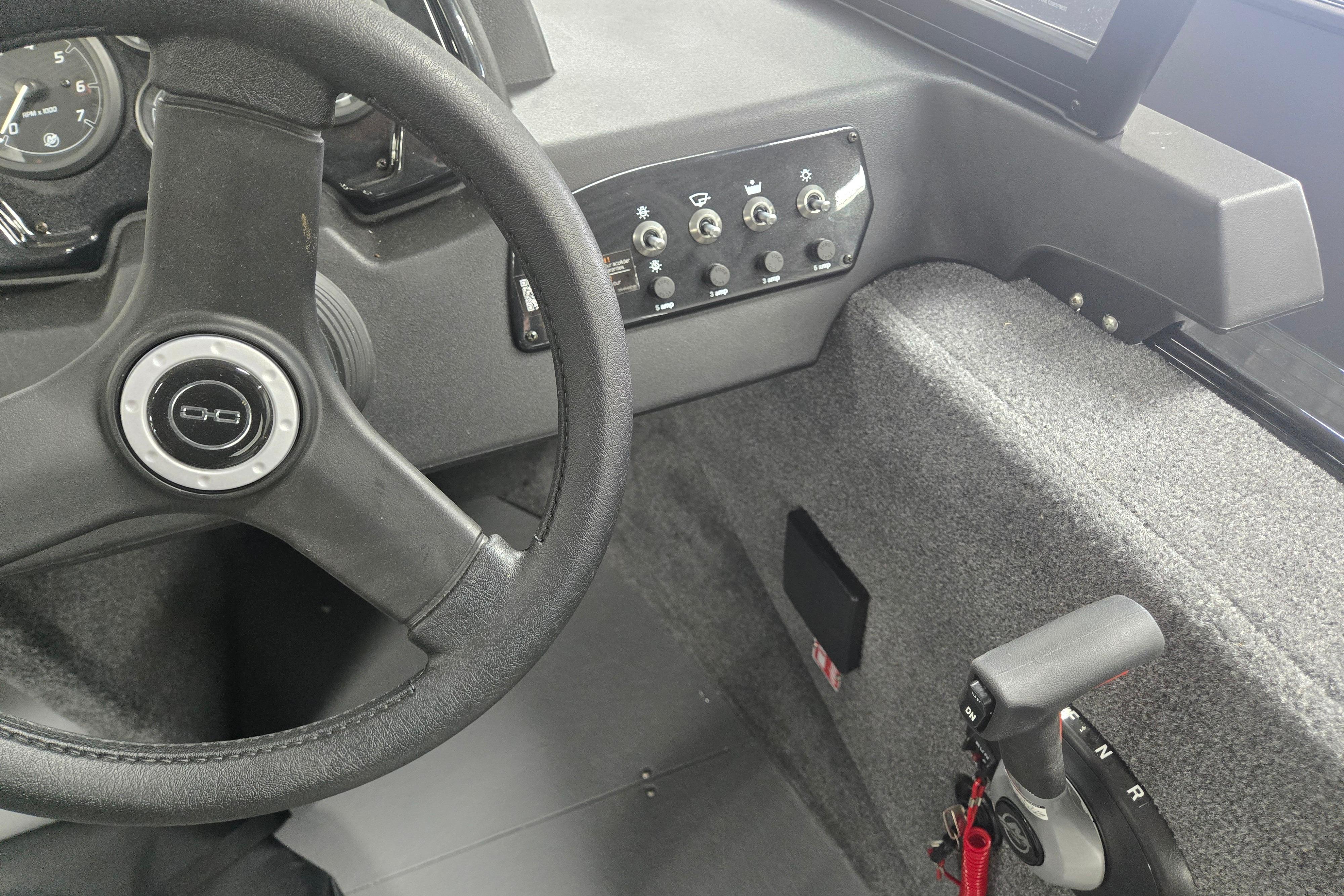 2026 Princecraft Sport 175 MAX boat dashboard with steering wheel and control panel.