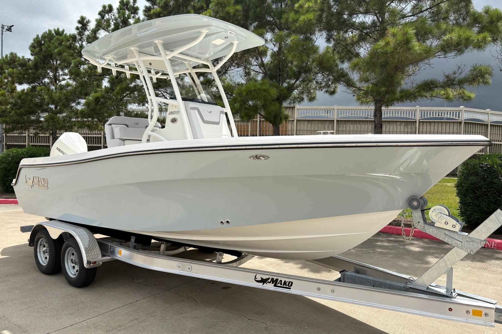 2026 Mako 226 Center Console boat on trailer, parked outdoors.