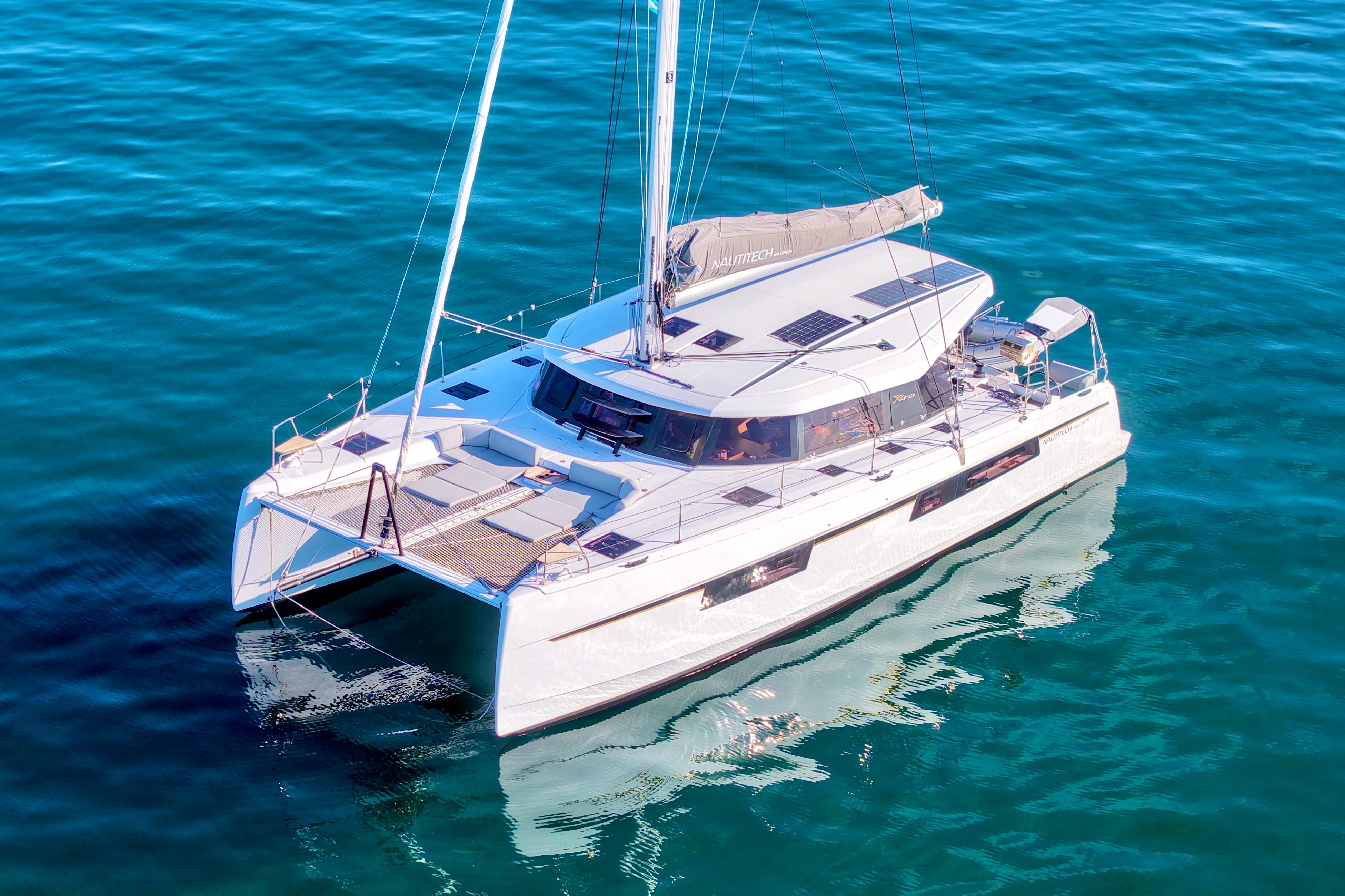 2023 Nautitech 44 Open catamaran sailing on clear blue water.