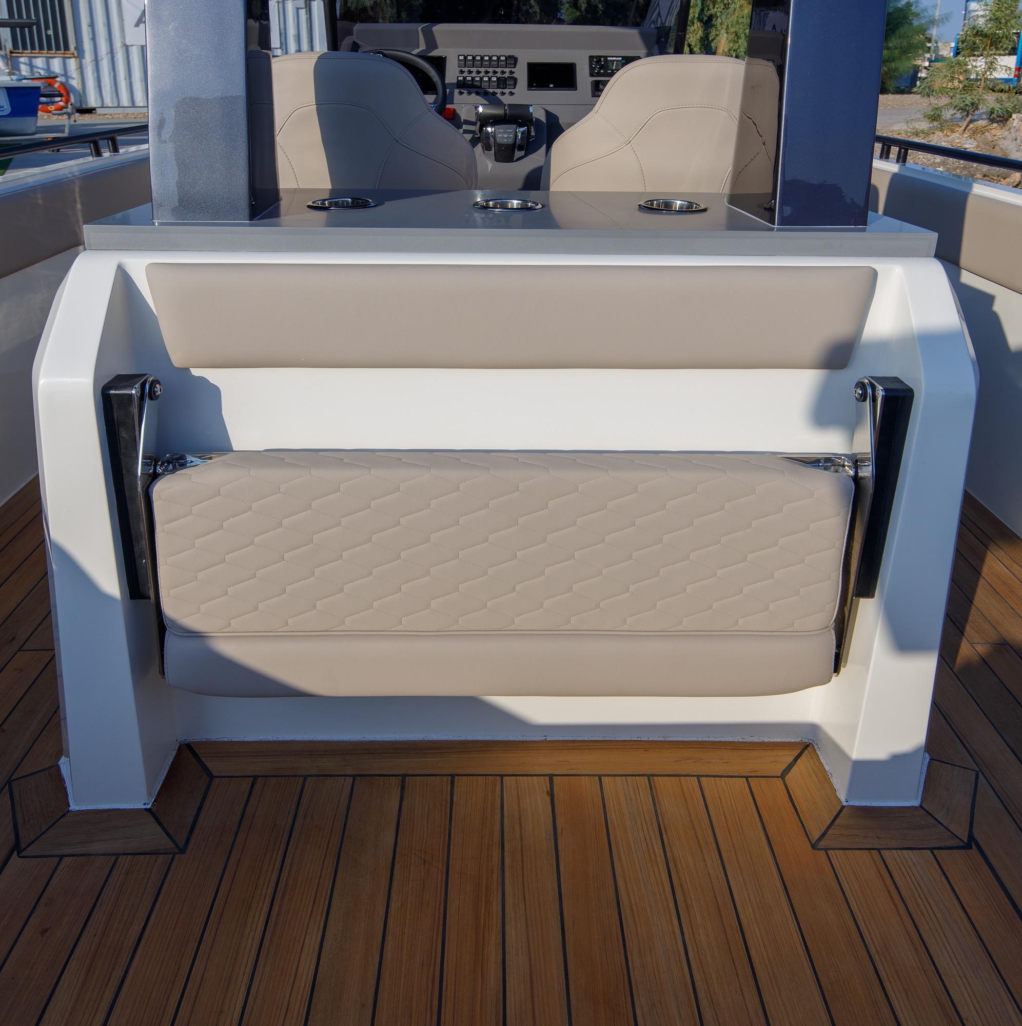 2021 Onda 371GT boat interior with beige seating and wooden deck.