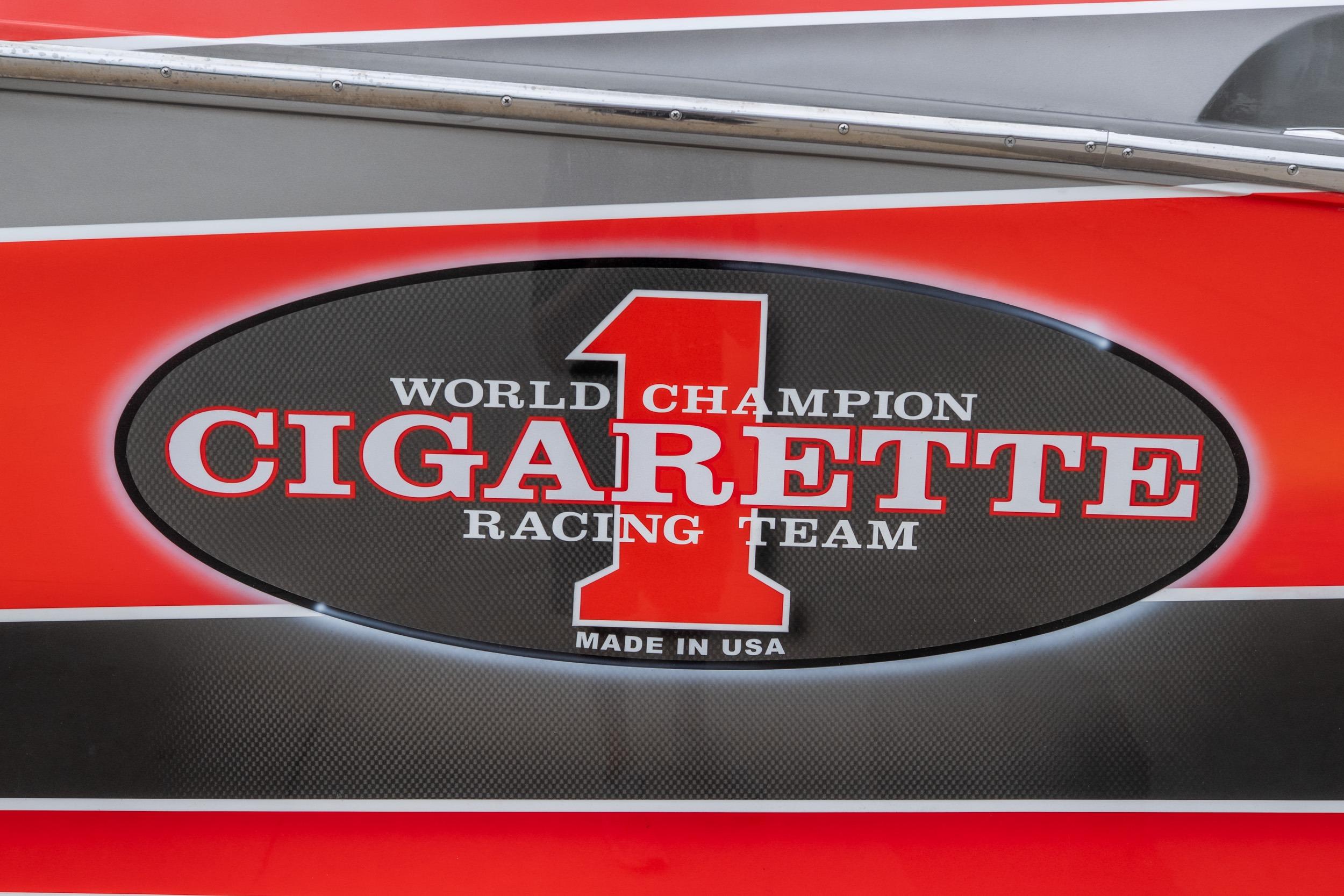 2006 Cigarette 39' Top Gun Unlimited, World Champion Racing Team logo, red and black design.