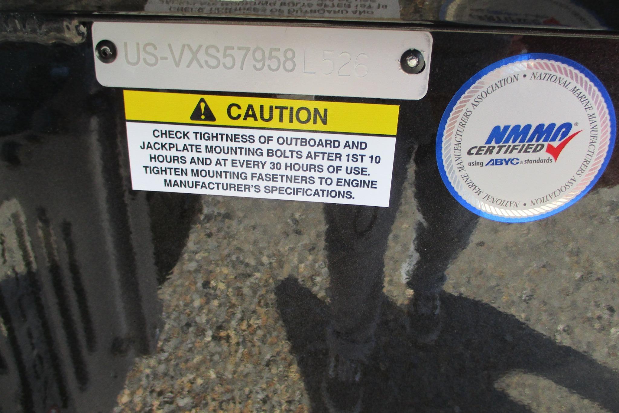 Caution label and NMMA certification on 2026 Vexus ACX2210 boat.