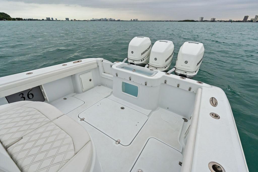 2021 Yellowfin 36 Offshore boat with triple Mercury engines on open water.
