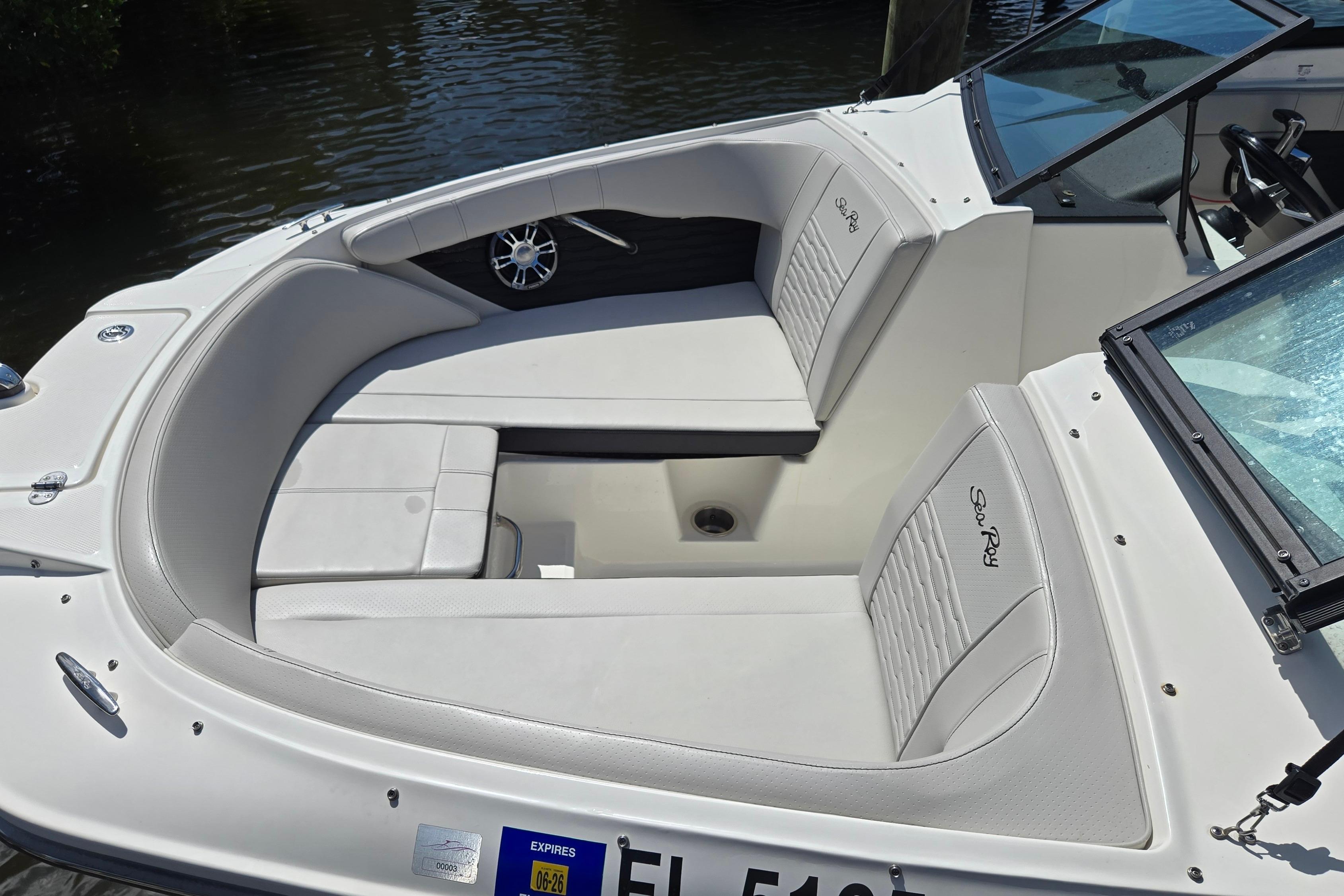 2023 Sea Ray SPX 210 boat interior with white seating and sleek design.
