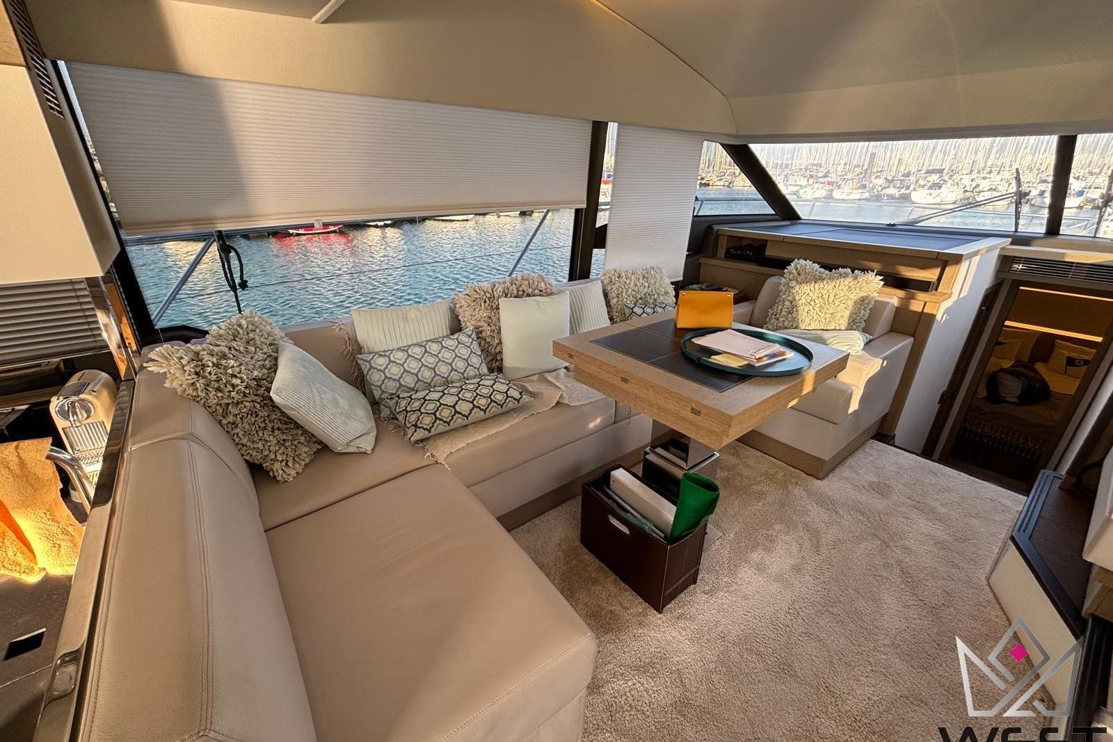 Luxurious interior of 2018 Prestige 520 yacht with plush seating and elegant decor.