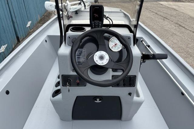 2026 Tracker Bass Tracker Classic CC boat console with steering wheel and controls.