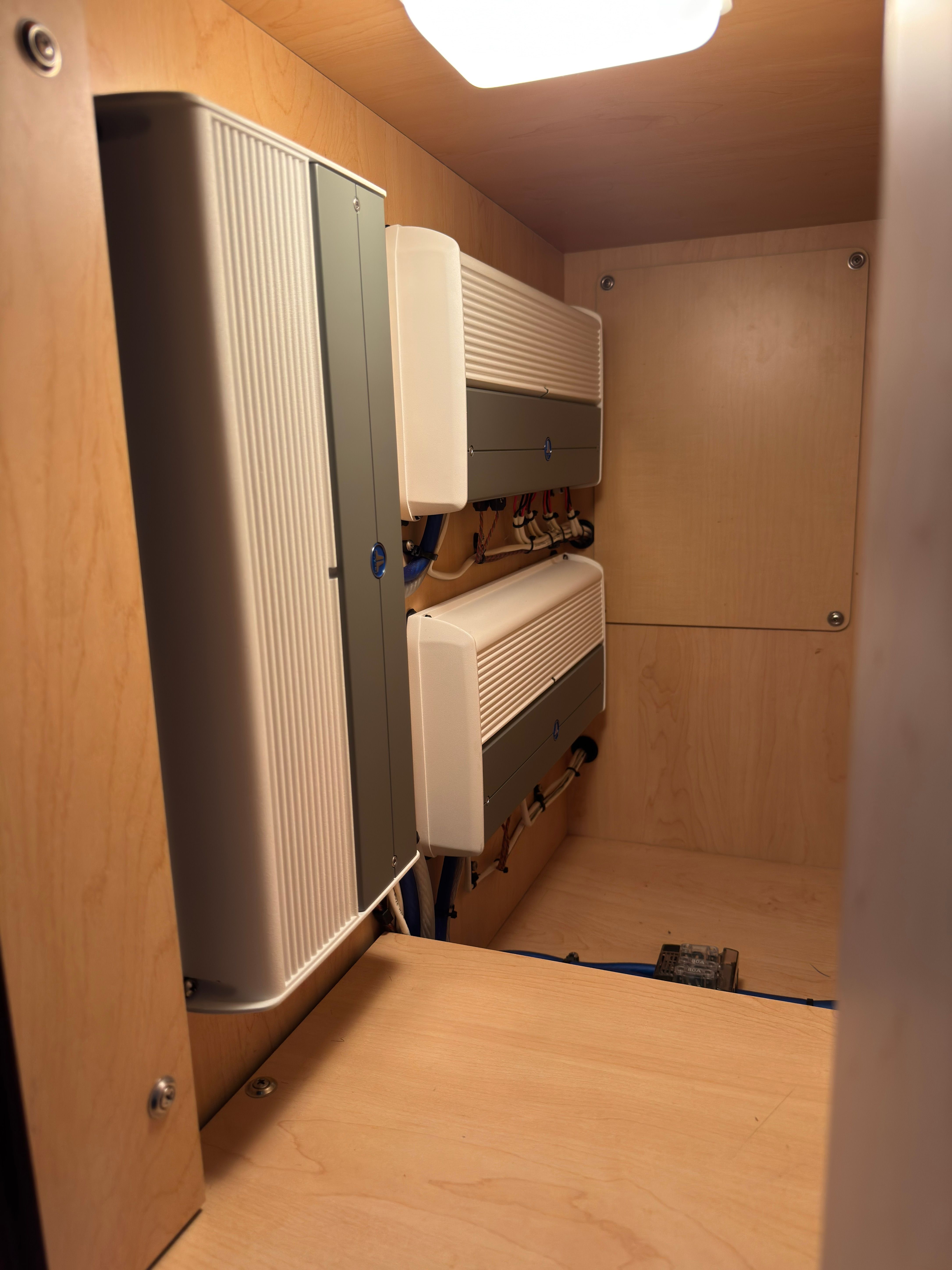 Electronic cabinets inside the 2007 Sea Ray 40 Sundancer.