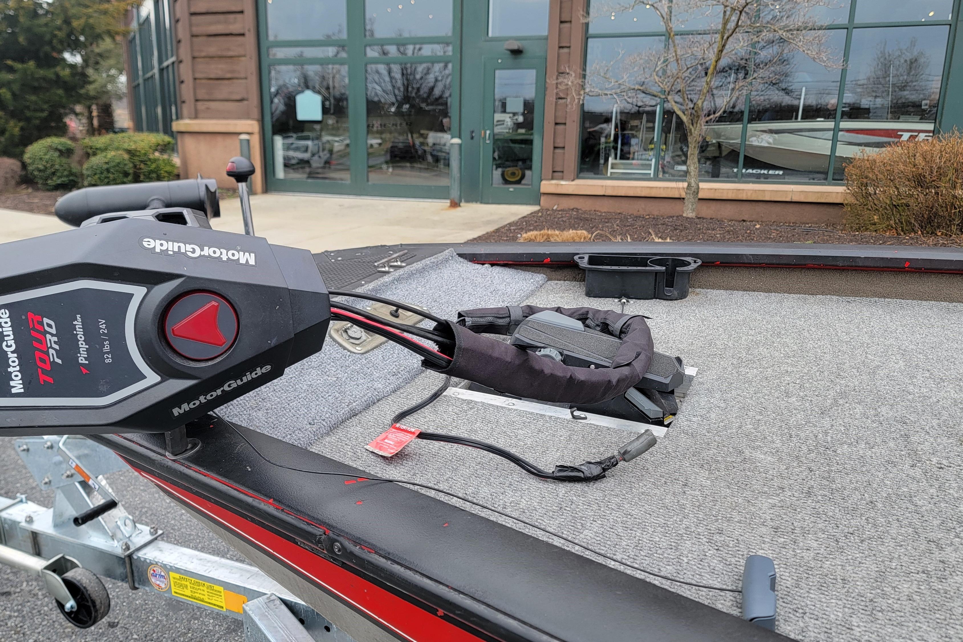 2006 Tracker Pro Team 190 TX boat with MotorGuide Tour Pro motor on trailer.