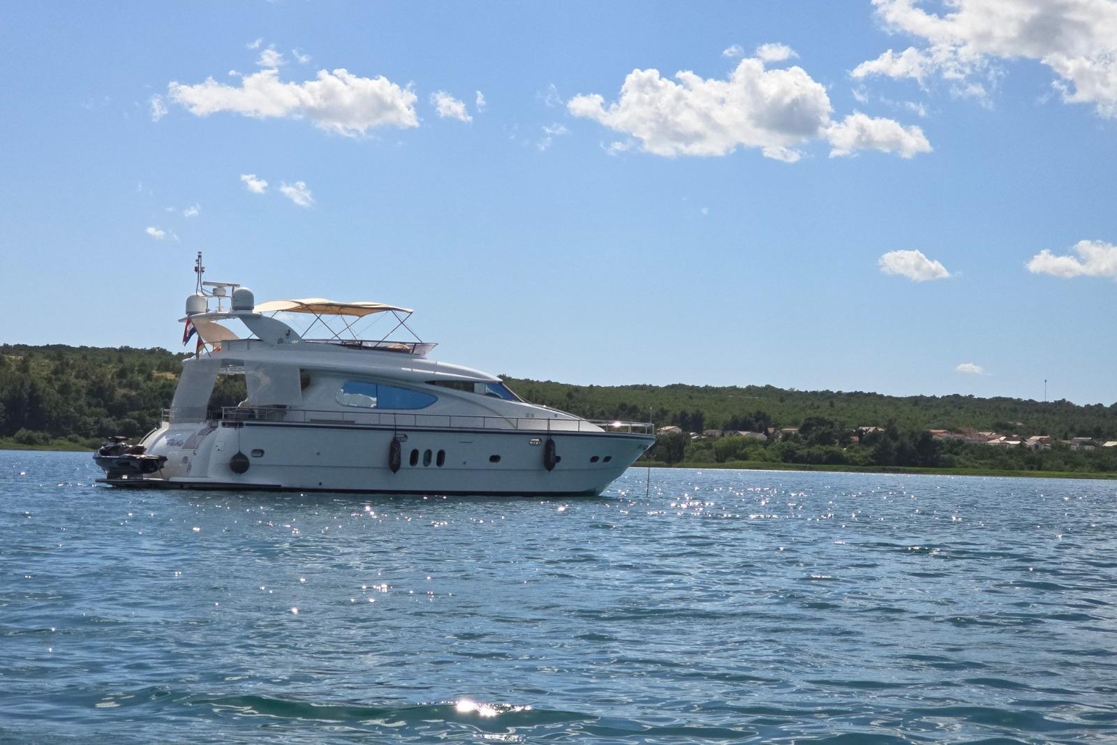 Luxury Elegance 64 yacht from 2007 on serene blue waters under a clear sky.