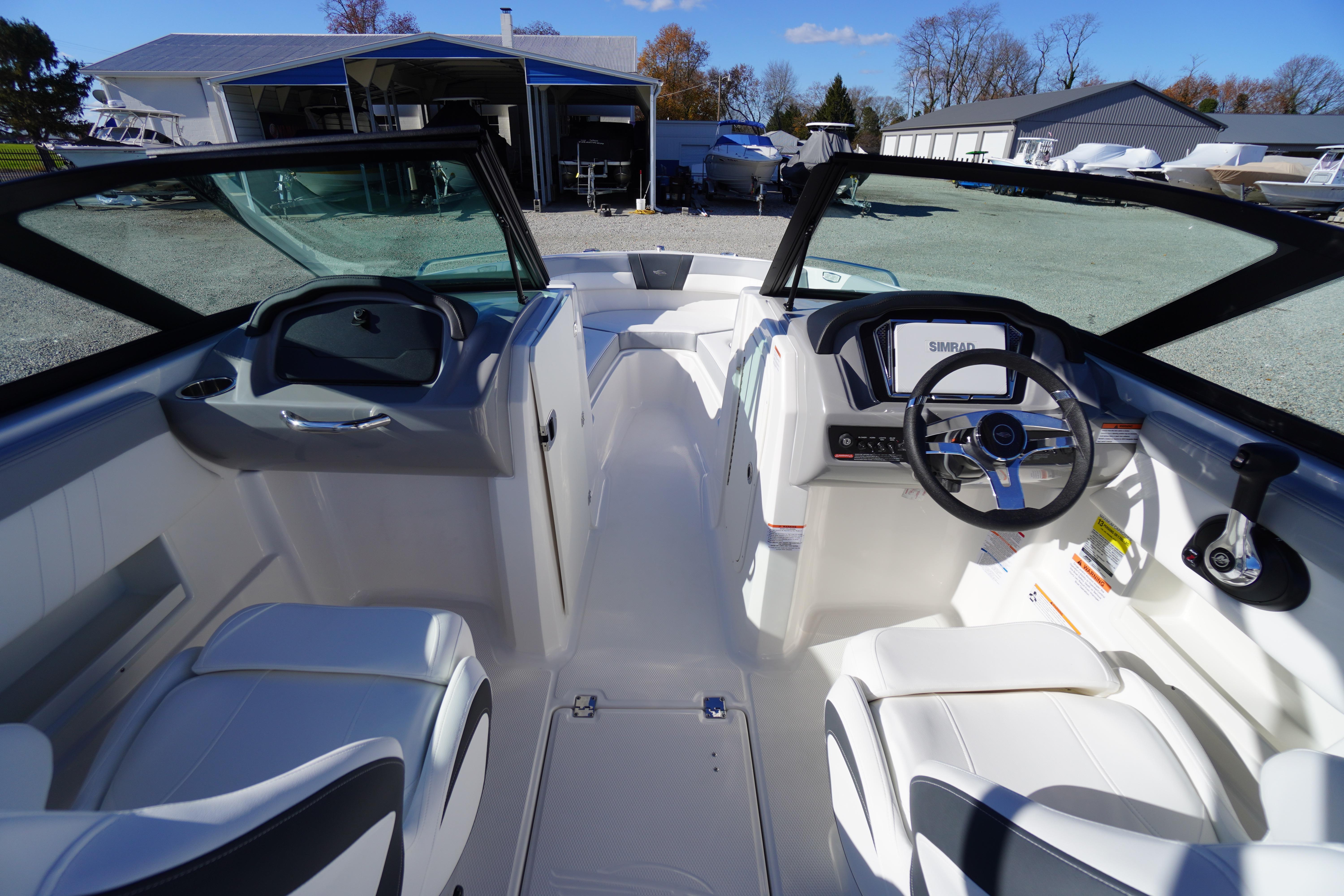 Interior view of 2026 Chaparral 23 SSi boat with modern dashboard and seating.