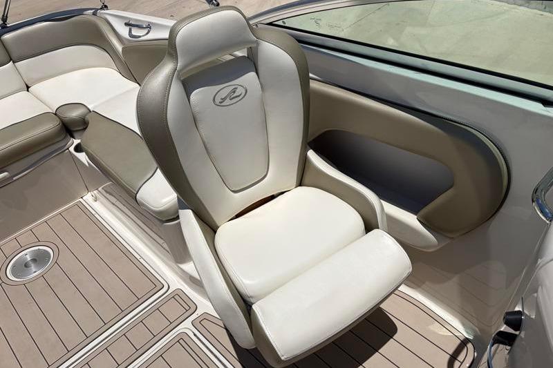 2007 Sea Ray 240 Sundeck interior with beige and white seating.