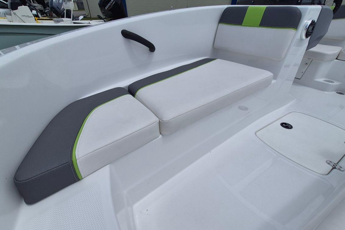 2021 Tahoe T16 boat interior with gray and green cushioned seating.