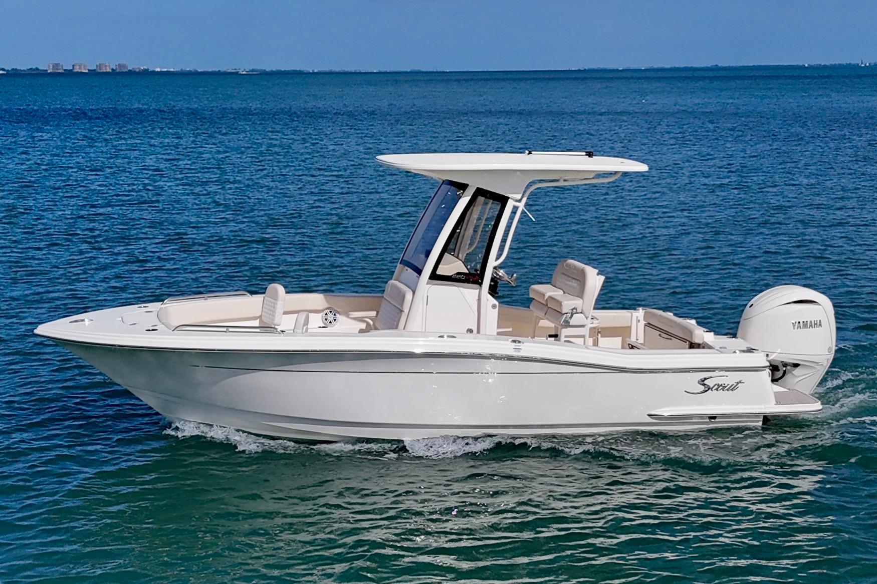 2026 Scout 220 XSF boat cruising on clear blue water.