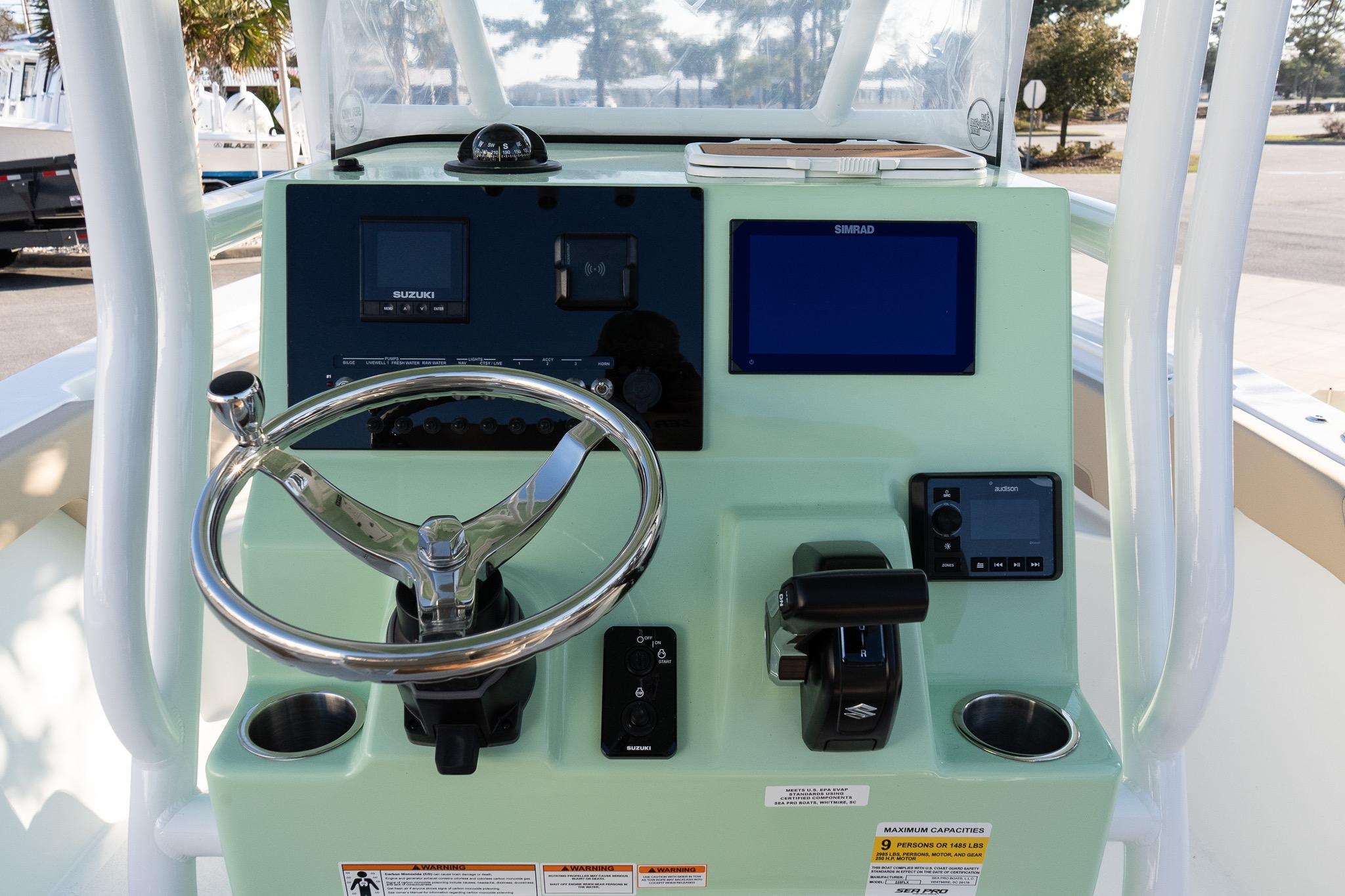 Helm of 2026 Sea Pro 225FLXR Sandbar boat with modern controls and displays.