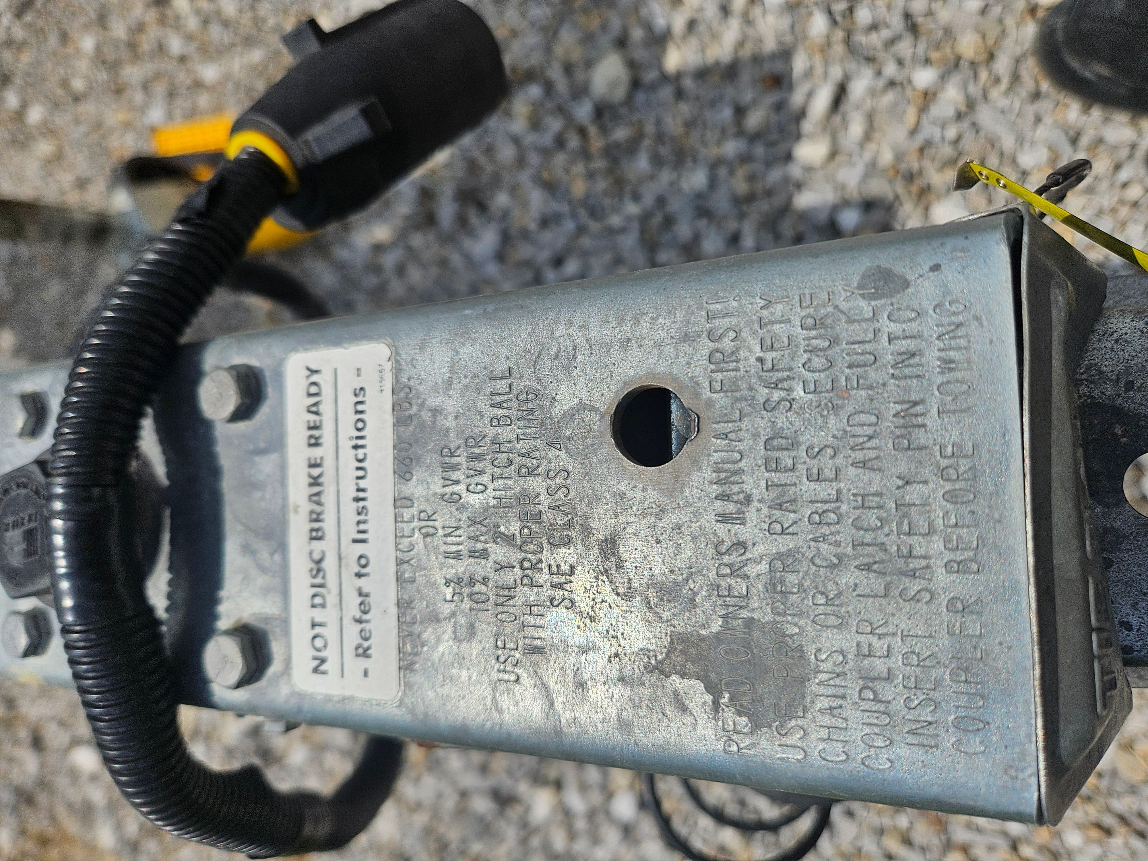Close-up of a 2010 Yacht Club R2466TB trailer with safety instructions.