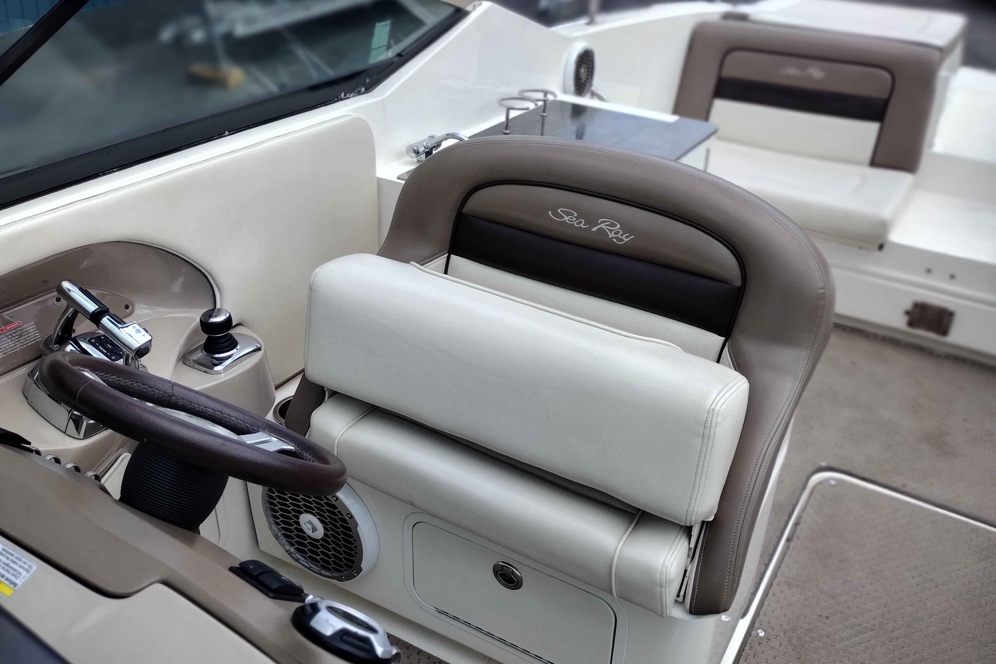 2013 Sea Ray 300 SLX boat interior with steering wheel and seating.