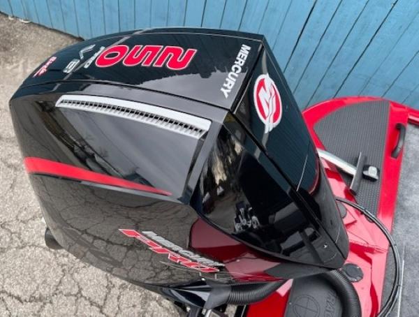2025 Tracker Savage 215 boat with Mercury engine, black and red design.