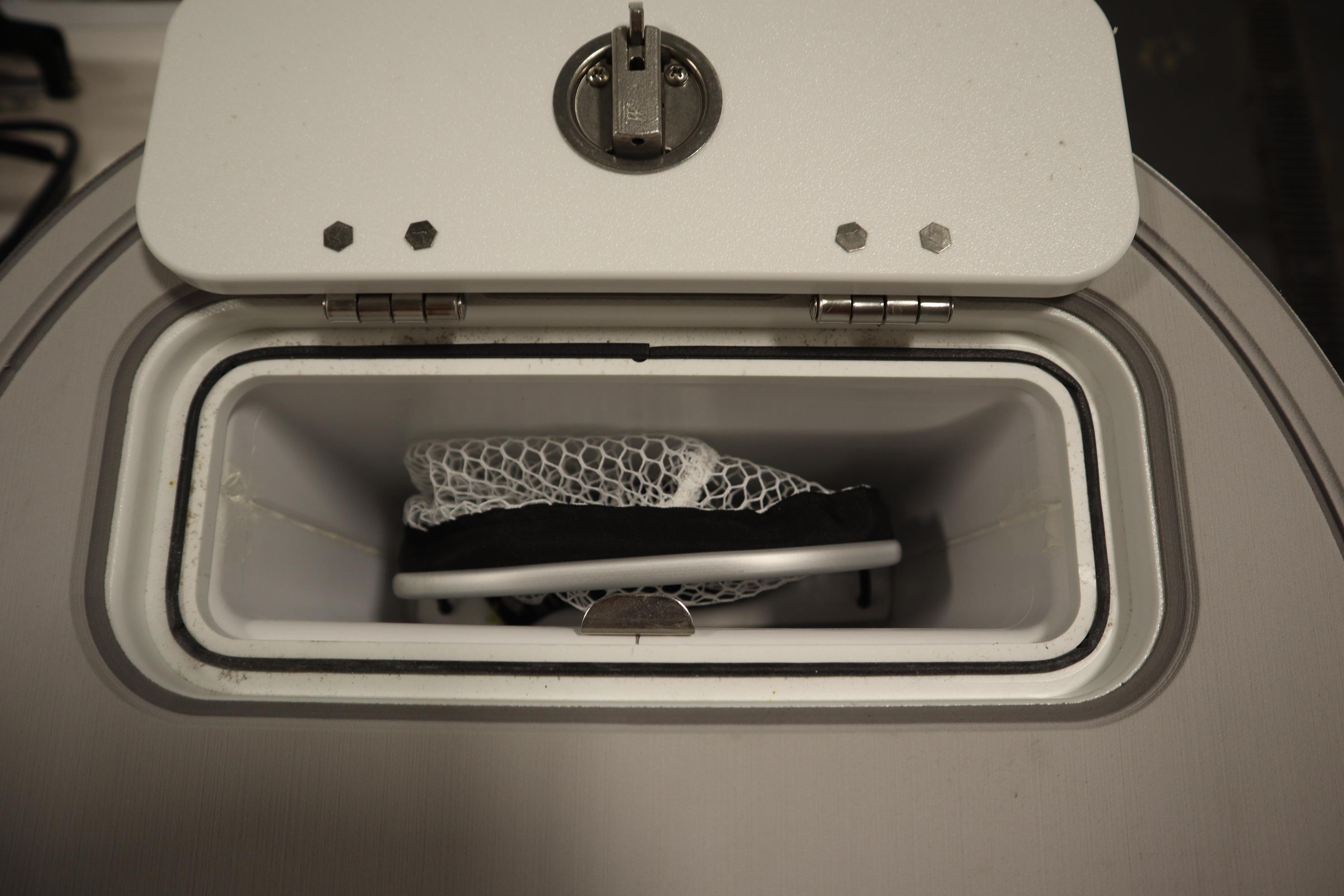 Storage compartment of 2026 Sea Fox 228 Commander boat, featuring a secure latch.