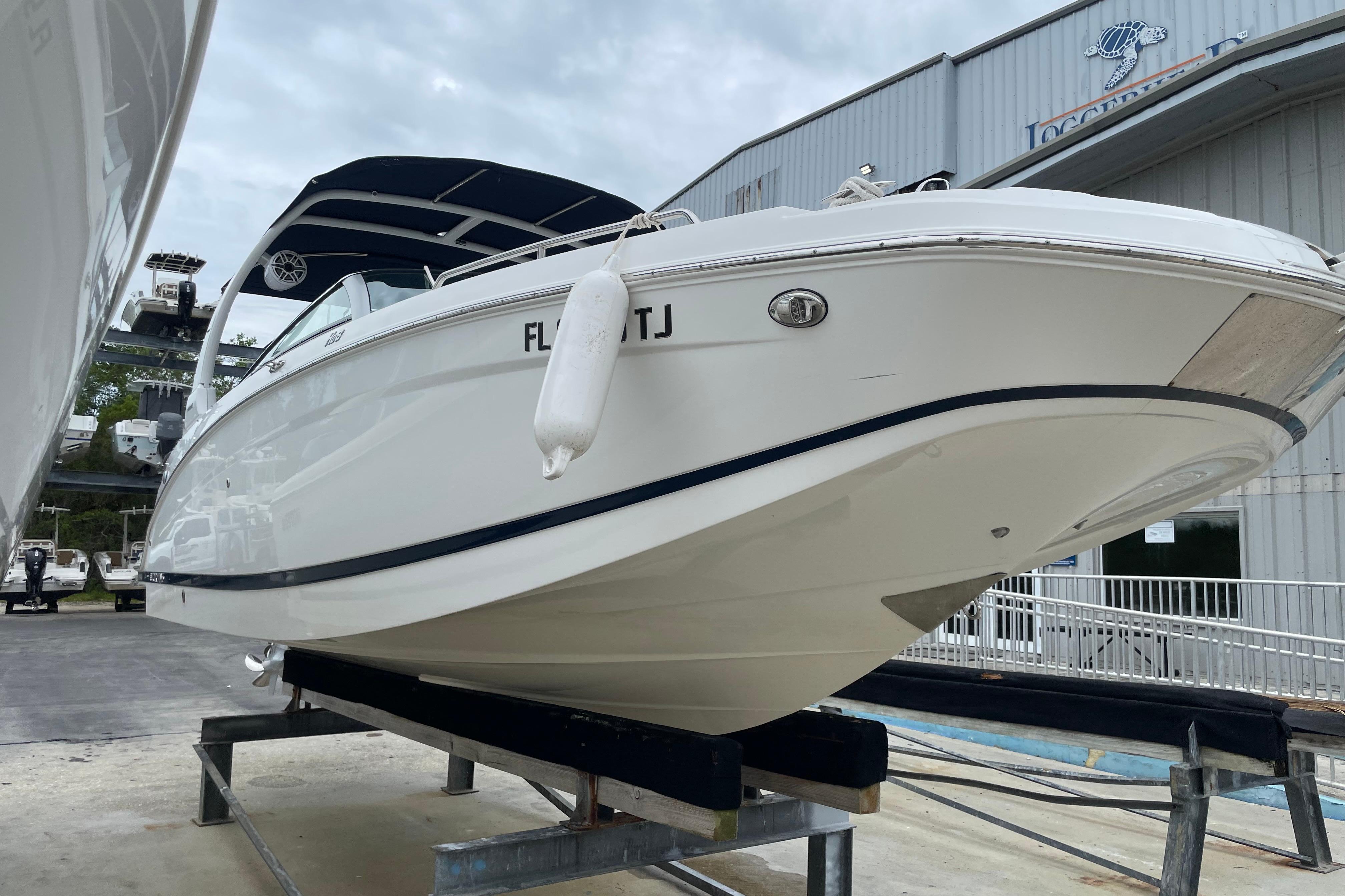 2022 Four Winns HD8 OB boat on display at a marina, showcasing sleek design.
