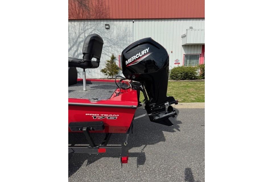 2026 Tracker Pro Team 175 boat with Mercury outboard motor, parked outdoors.