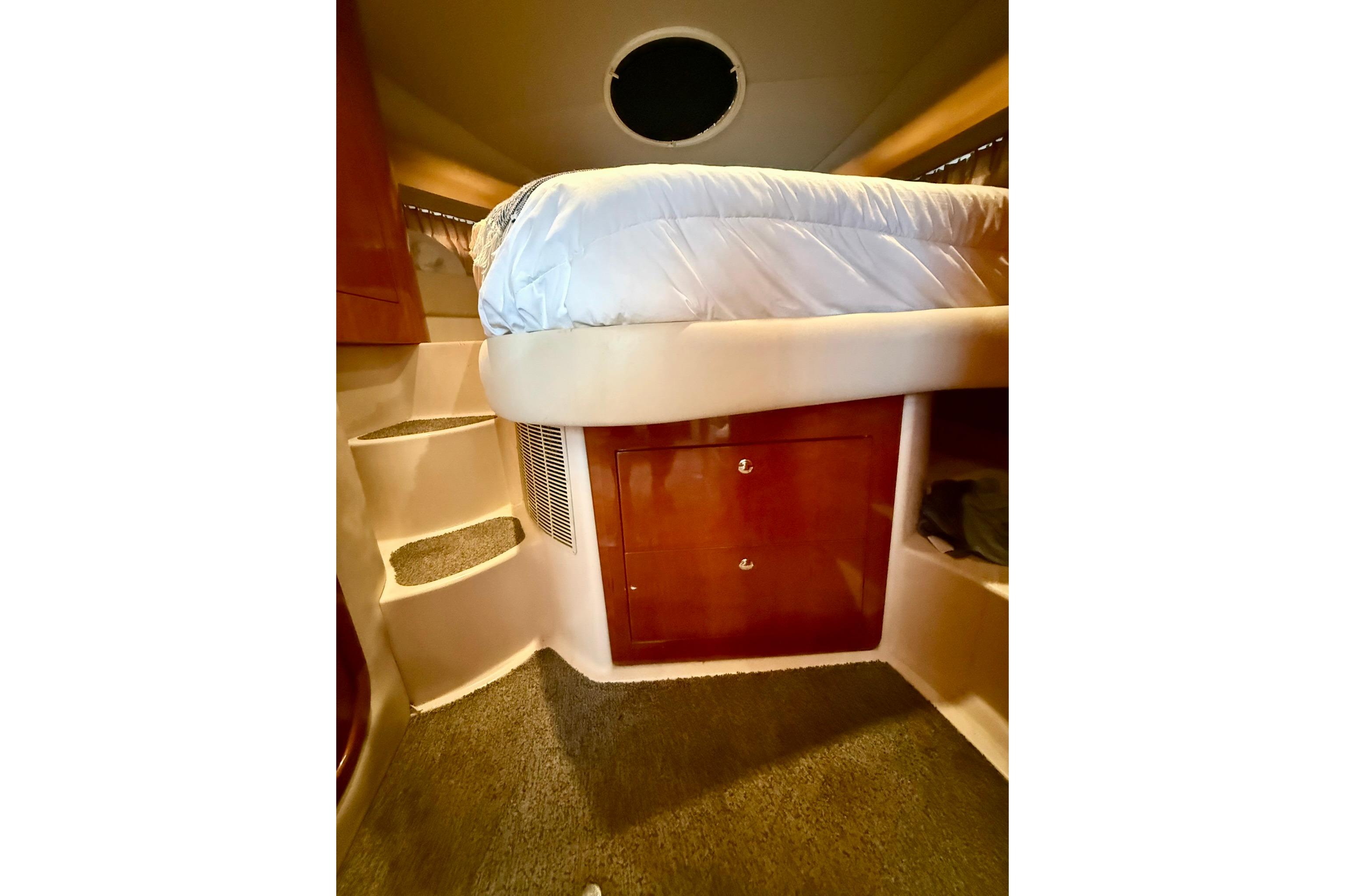 Interior of 2006 Regal Commodore 4060 yacht with bed and storage.
