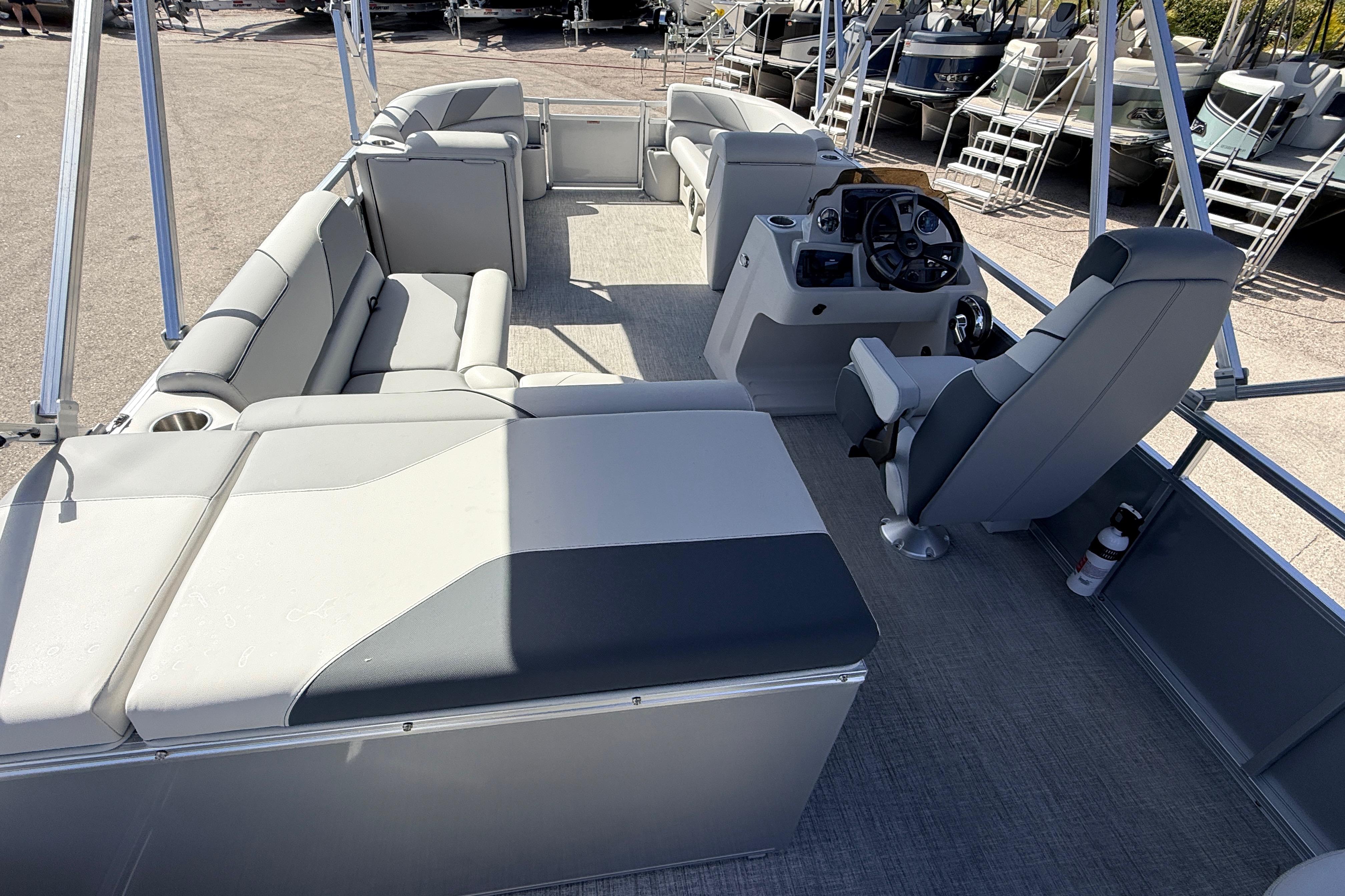 2026 Avalon 2385 Venture 85 Tri Toon boat interior with seating and steering console.