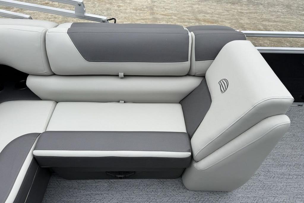 2026 Sun Tracker Fishin' Barge 20 DLX, featuring sleek gray and white seating.