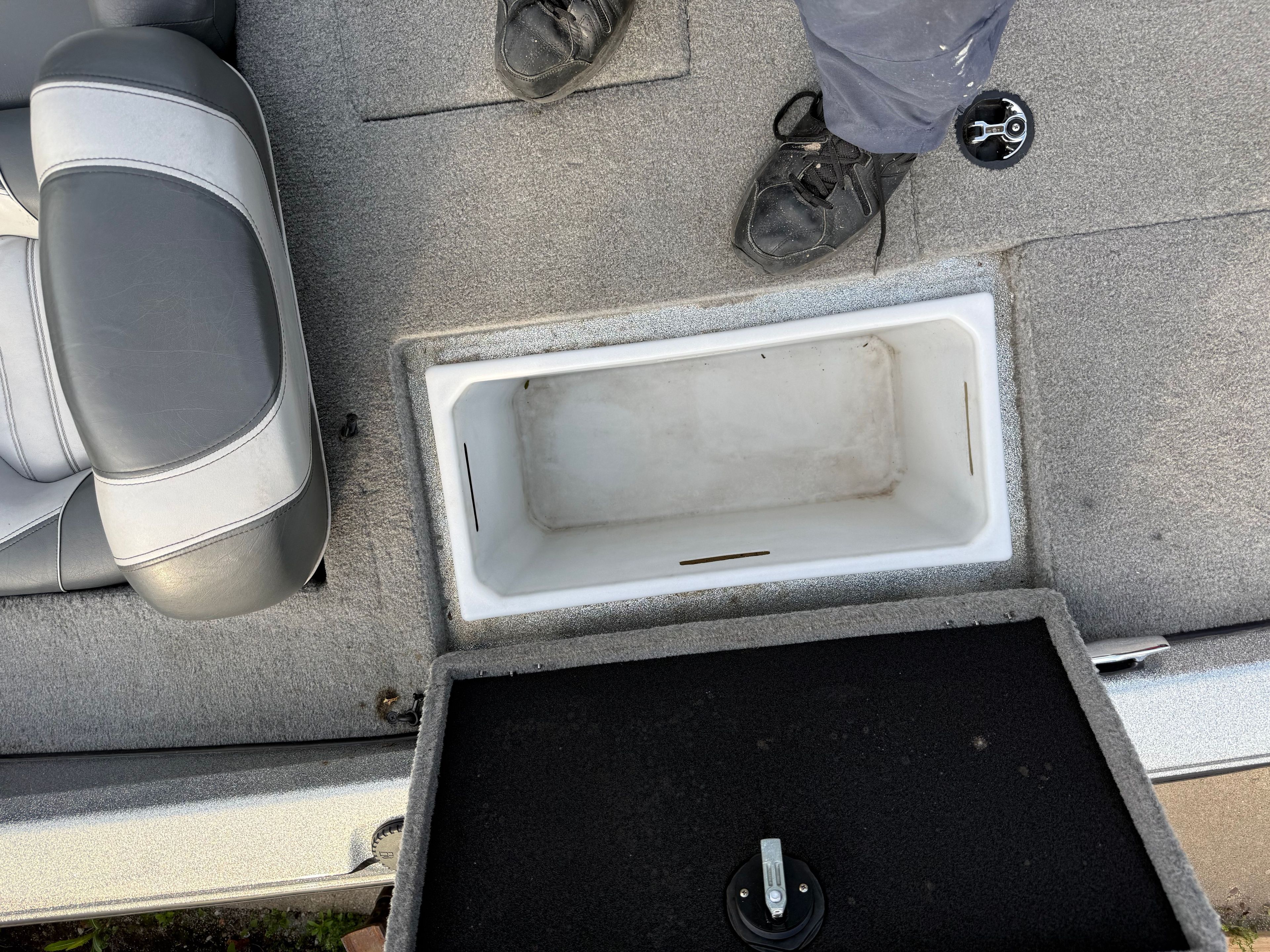 Interior of a 2004 Nitro NX 898 DC boat with storage compartment.