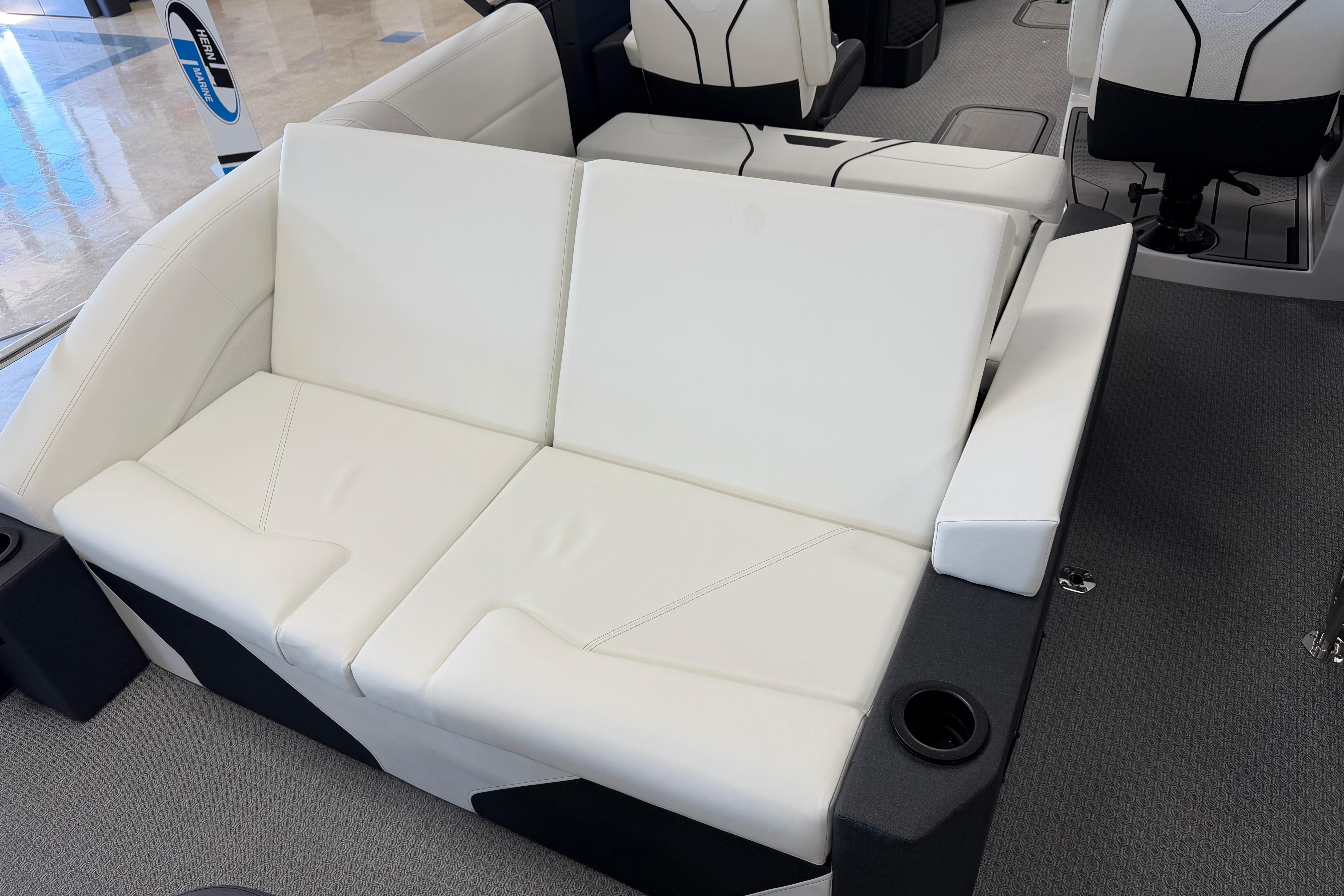 Luxurious white seating on 2026 Evotti 721CS boat, featuring cup holders and modern design.