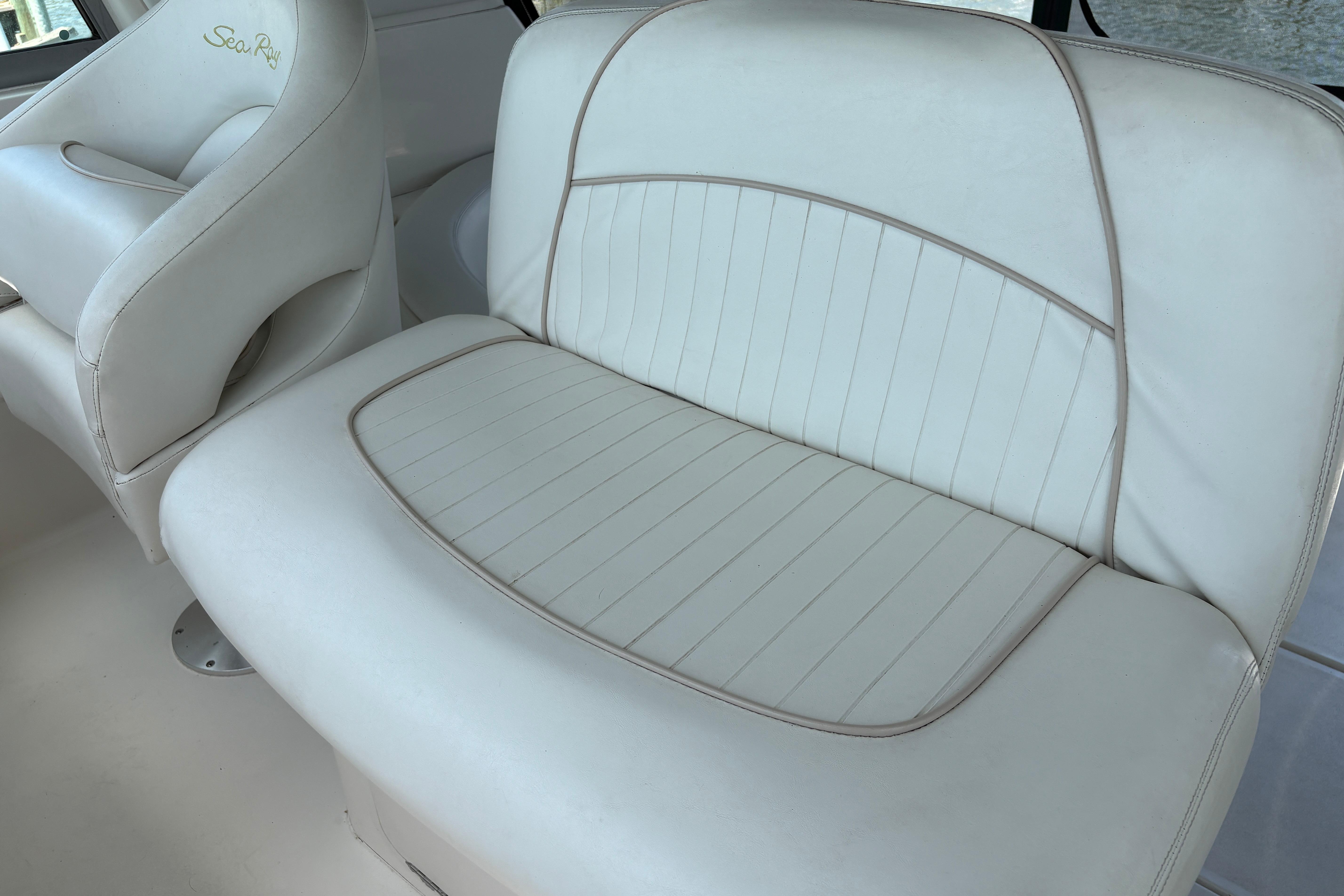 White leather seating on a 2001 Sea Ray Sundancer 310 boat.