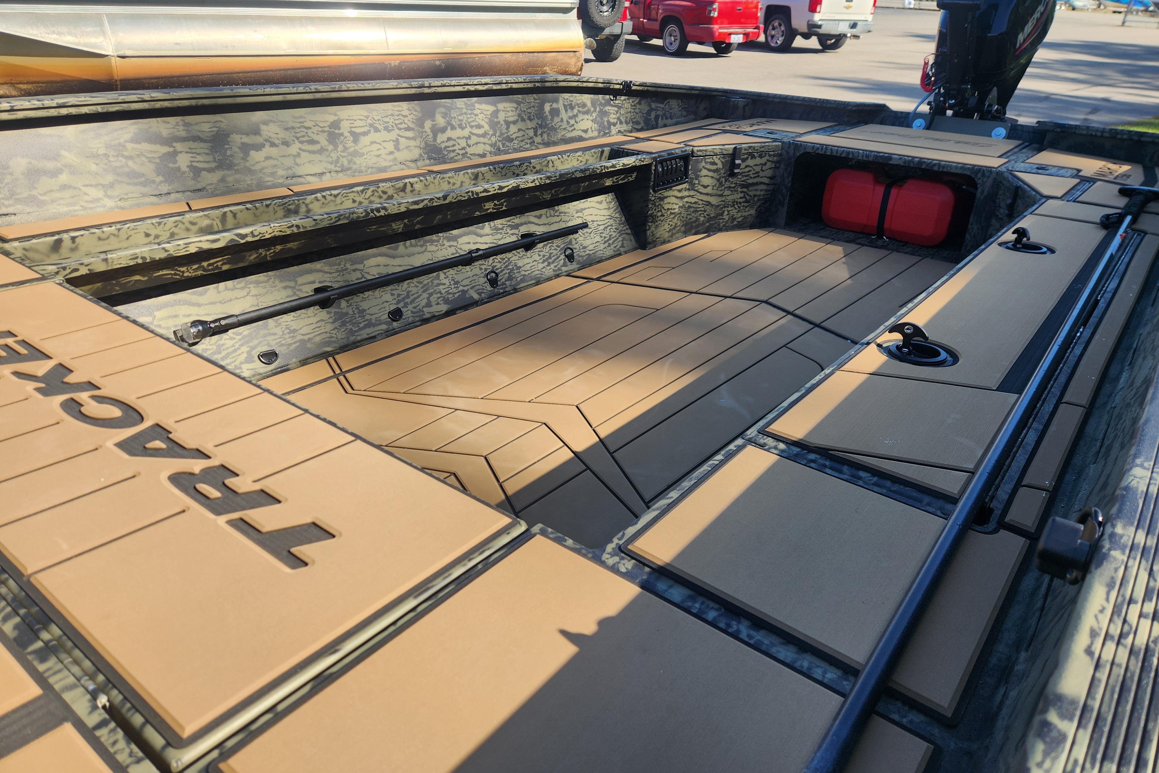 2026 Tracker Grizzly 1756 T Marsh boat interior with camo design and spacious deck.