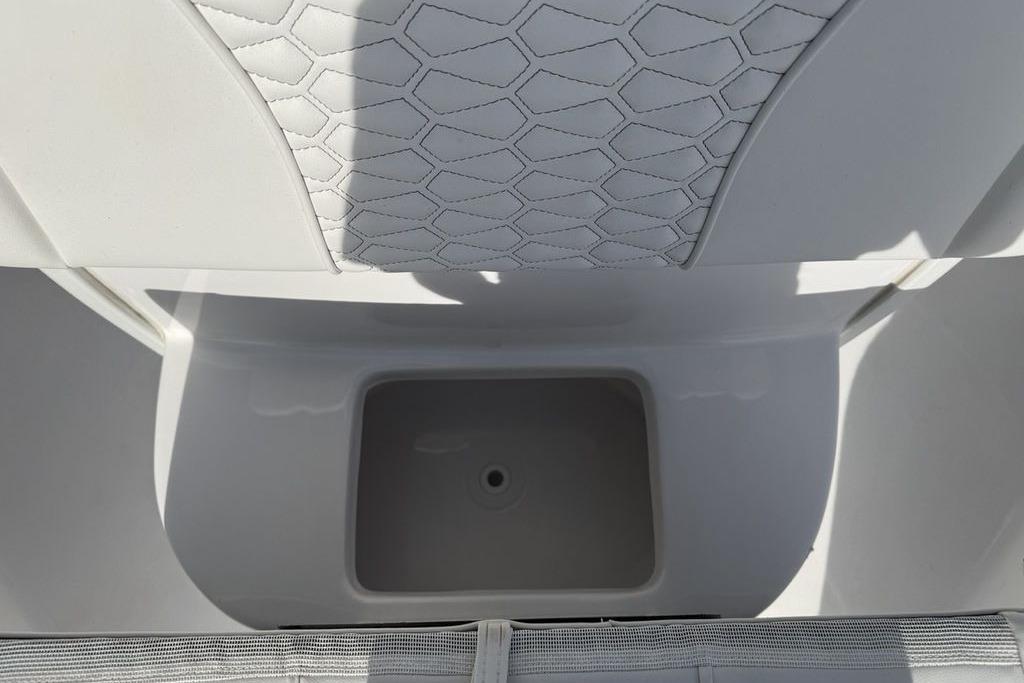 Interior view of 2026 Tidewater 232 LXF boat with storage compartment.