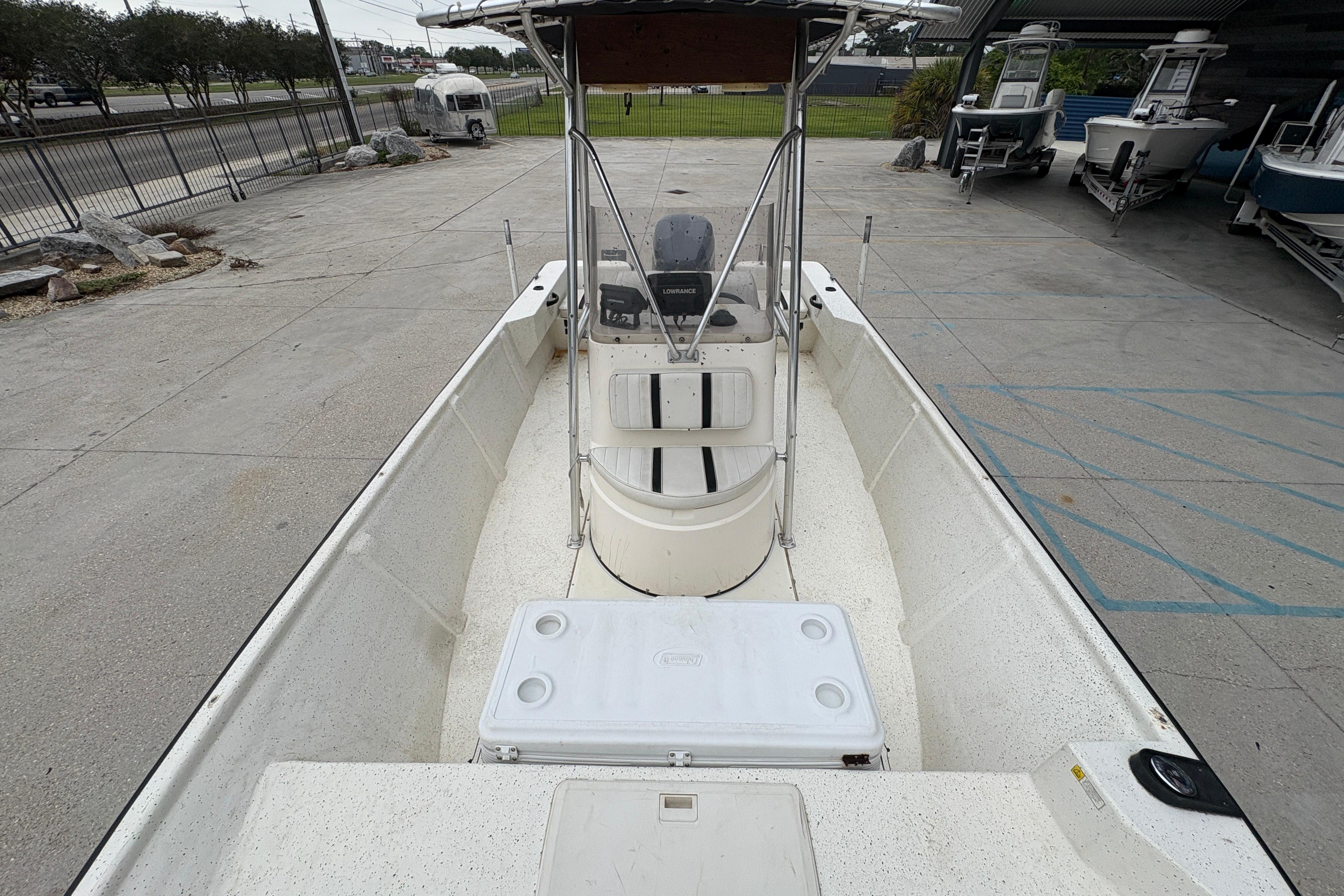1998 Hydra-Sports 22 Ocean CC boat with center console and T-top in a parking area.