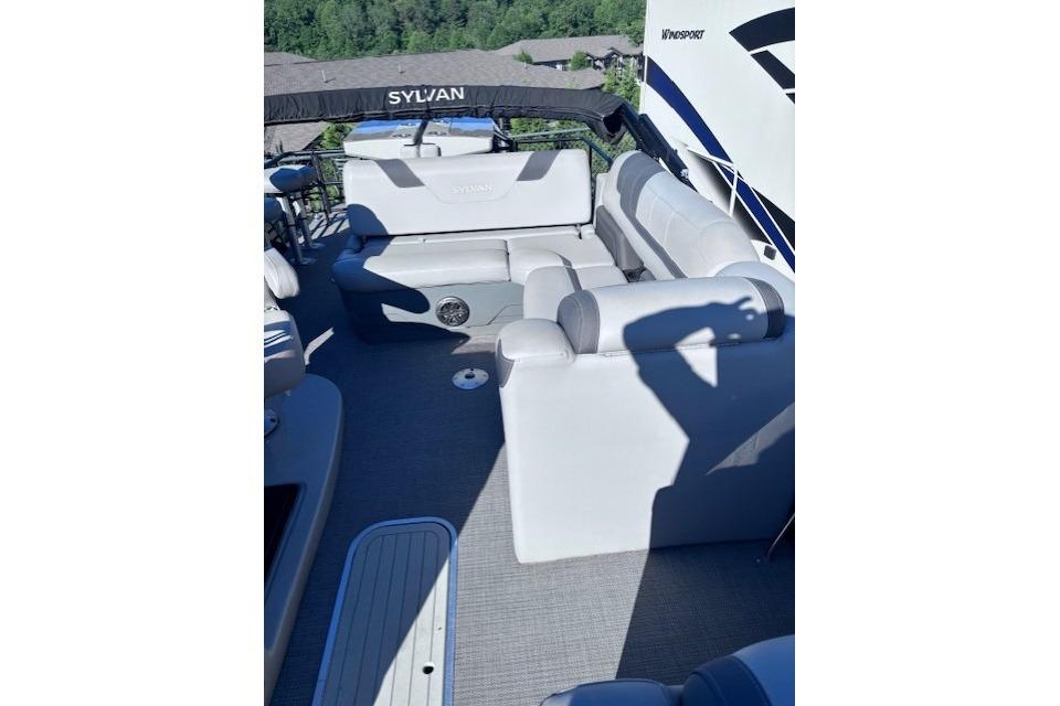 2022 Sylvan L3 DLZ Bar pontoon boat with spacious seating and modern design.